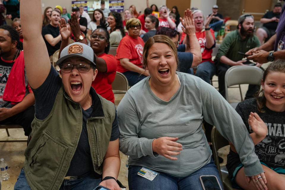 People celebrate while watching the vote tally at a United Auto Workers (UAW) vote watch party on April 19, 2024, in Chattanooga, Tennessee.  / Credit: Elijah Nouvelage/Getty Images