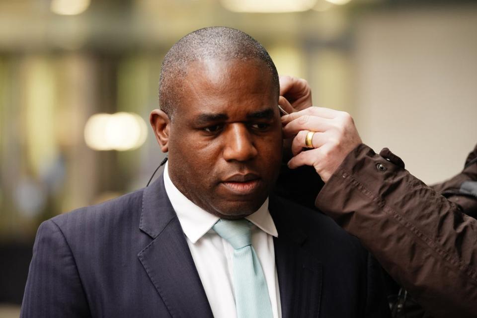 Shadow foreign secretary David Lammy is fitted with an ear piece for a TV interview at BBC Broadcasting House (Aaron Chown/PA) (PA Wire)