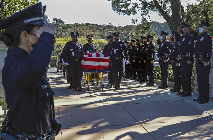 Los Angeles, CA - February 02: Pallbearers carry the casket at the funeral services of LAPD Officer Fernando Arroyos at Forest Lawn Hollywood Hills on Wednesday, Feb. 2, 2022 in Los Angeles, CA. (Irfan Khan / Los Angeles Times)