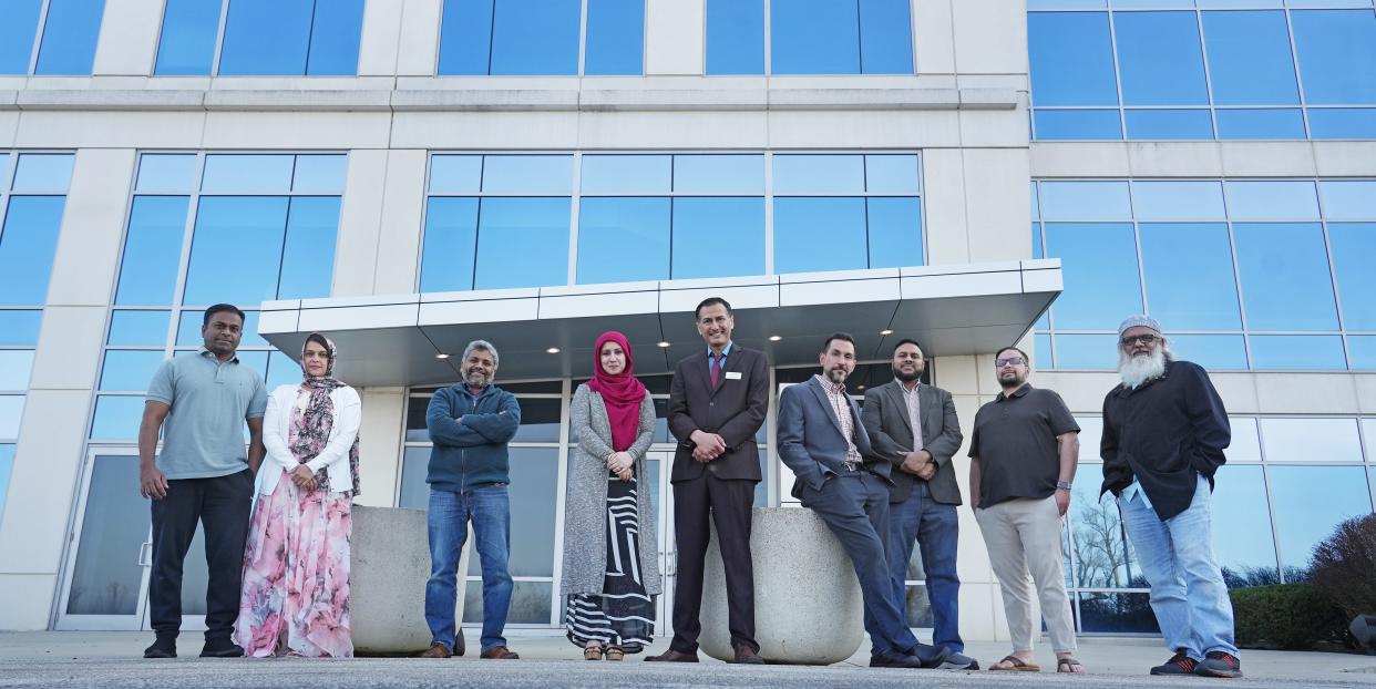 The Noor Islamic Cultural Center recently purchased a 220,000-square-foot office building near their mosque. Stakeholders include, from left, Taj Mohammed, Rubi Taj, Atif Syed, Atifa and Imran Malik, Ronney Abaza, Mahmood Khan, Shams Khan and Mohammed Azhar Masood.