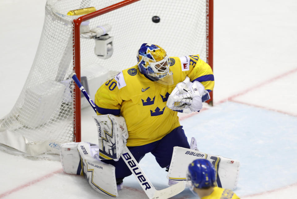 Sweden's goalkeeper Henrik Lundqvist fails to stop Finland's fifth goal during the Ice Hockey World Championships quarterfinal match between Finland and Sweden at the Steel Arena in Kosice, Slovakia, Thursday, May 23, 2019. (AP Photo/Petr David Josek)