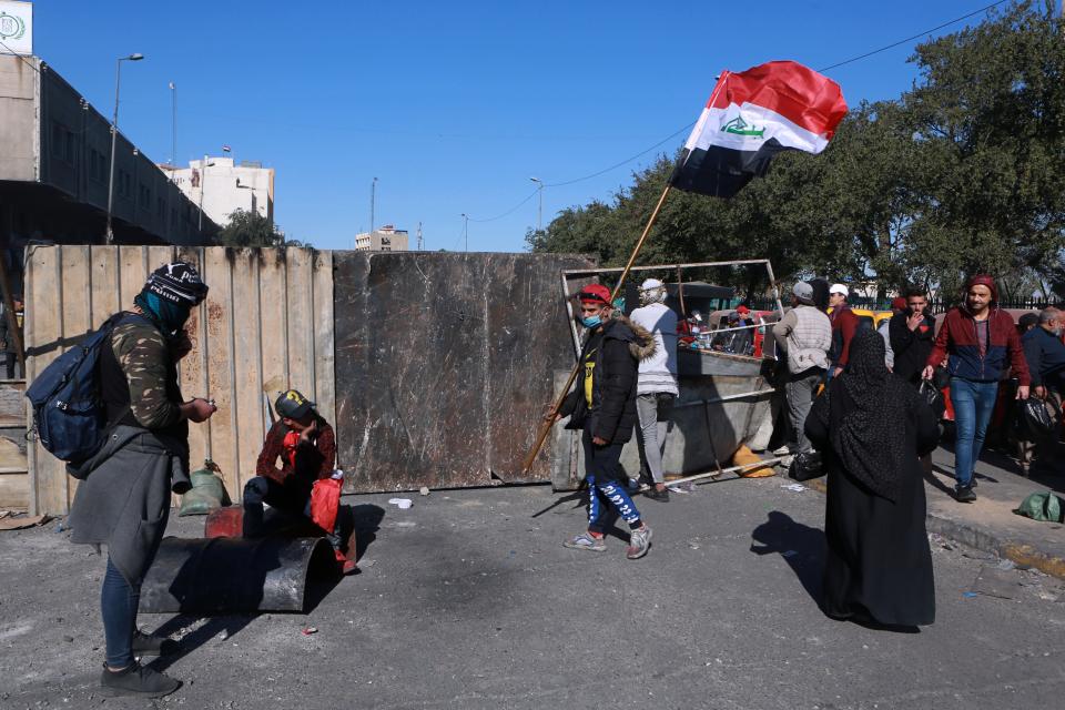 Protesters close a street during ongoing anti-government protests in downtown Baghdad, Iraq, Saturday, Feb. 1, 2020. (AP Photo/Khalid Mohammed)