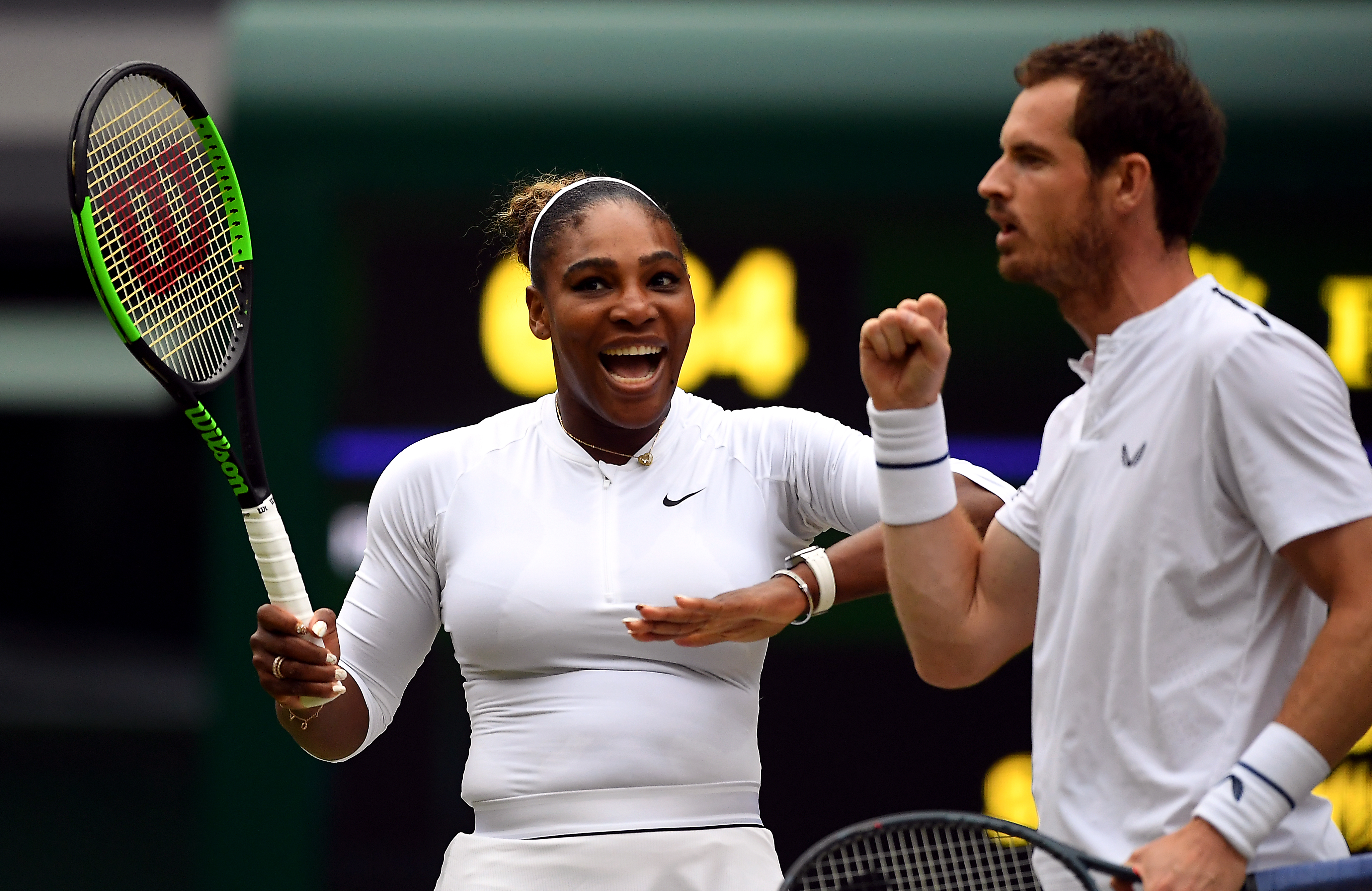 Serena Williams and Andy Murray during their mixed doubles match on day eight of the Wimbledon Championships at the All England Lawn Tennis and Croquet Club, Wimbledon.