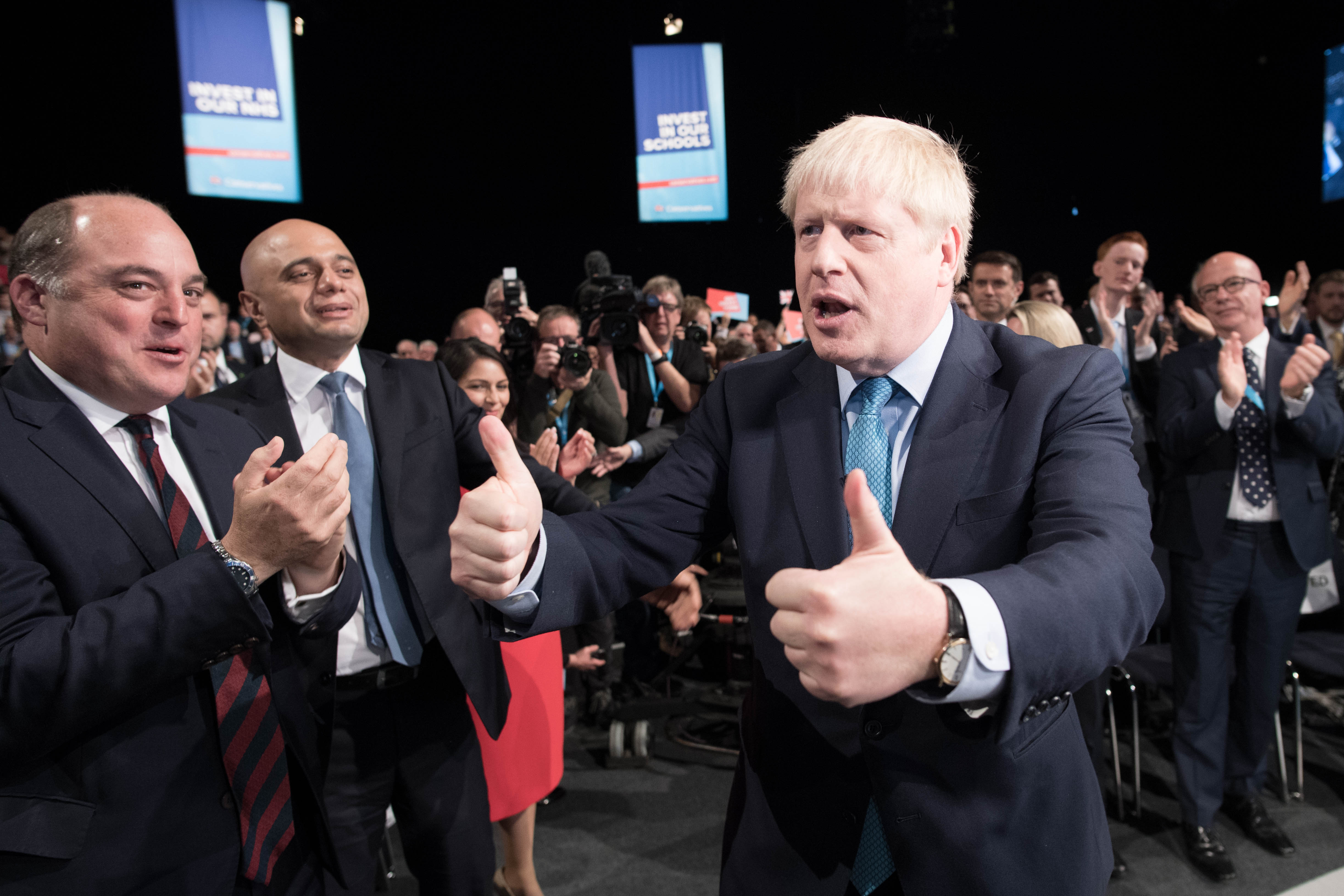 Prime Minister Boris Johnson gives a thumbs up as he leaves the stage after delivering his speech during the Conservative Party Conference at the Manchester Convention Centre.