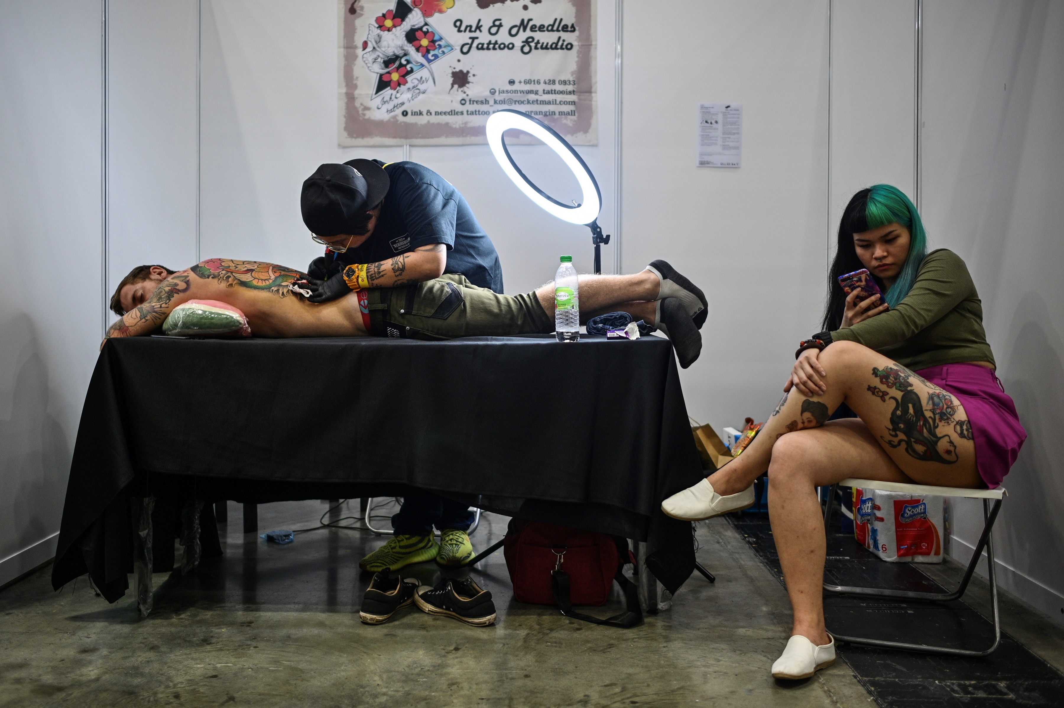 Malaysian Mp Calls For Investigation Over Semi Naked Tattoo Exhibition Photos