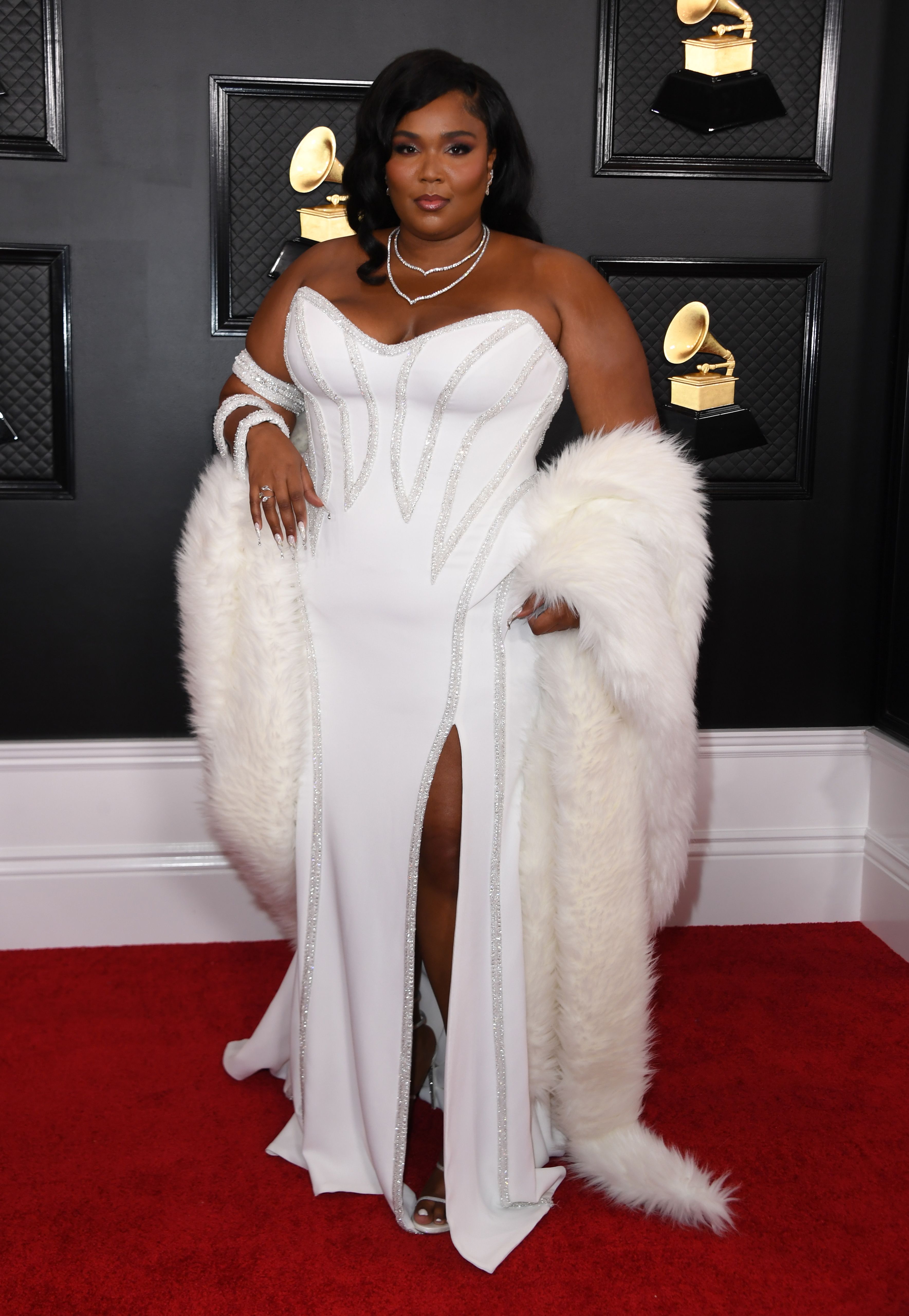 Lizzo hits the Grammys red carpet in whitehot gown