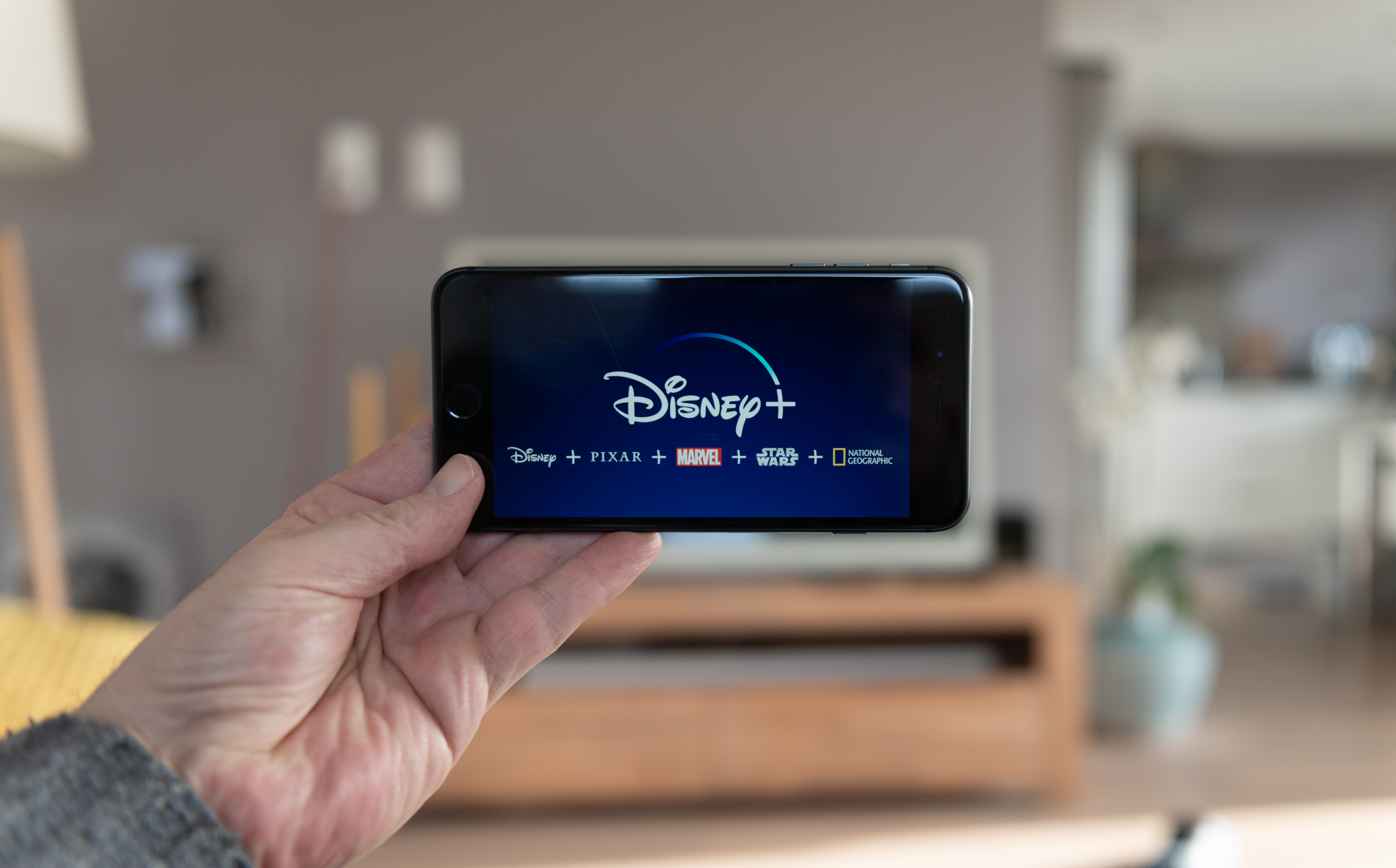 Amsterdam, The Netherlands, 02/03/2020, Disney+ startscreen on  mobile phone. Disney+ online video, content streaming subscription service. Disney plus, Star wars, Marvel, Pixar, National Geographic.