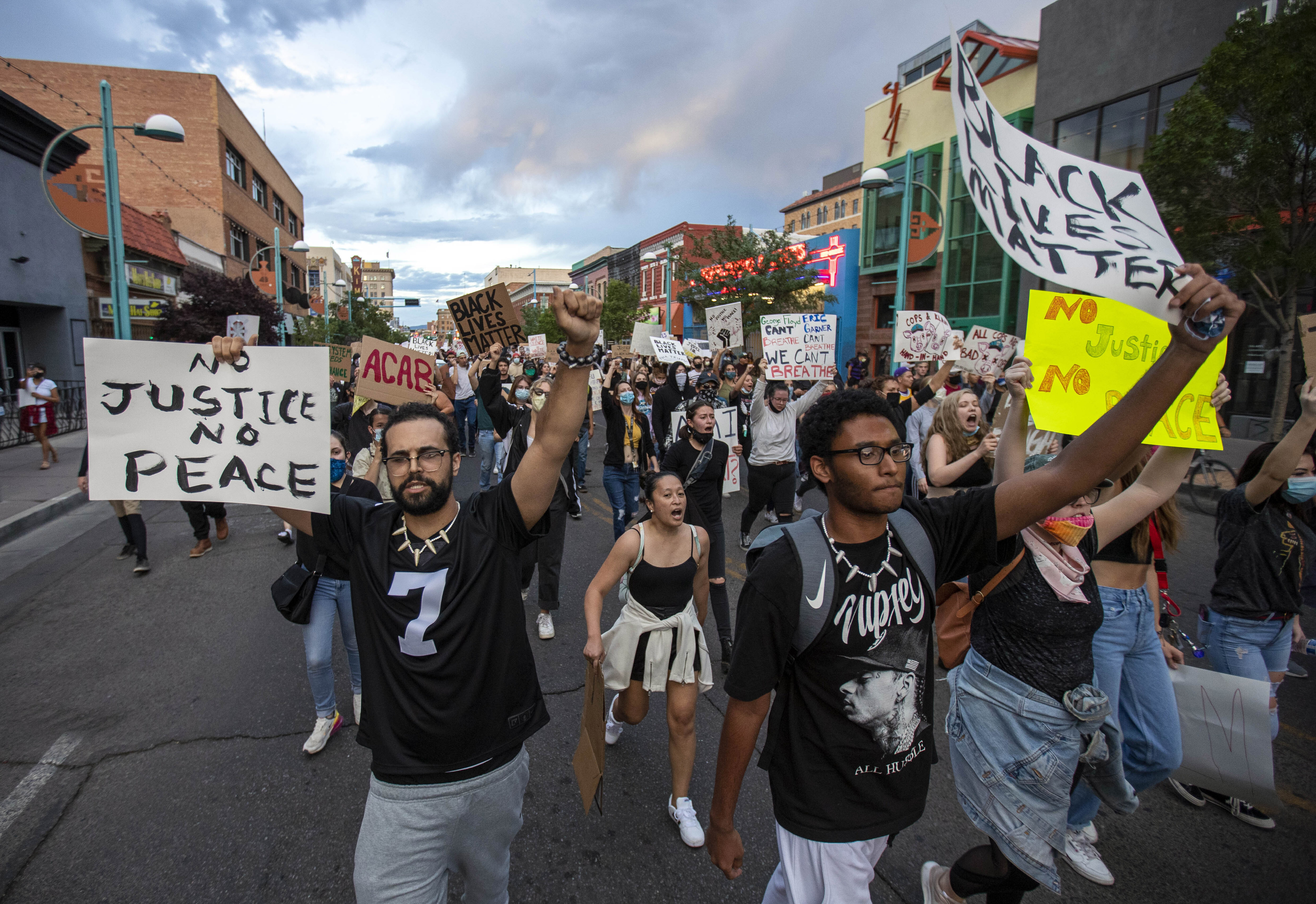 Demonstrators protest the death of George Floyd in downtown Albuquerque, N.M., Sunday, May 31, 2020. Floyd was a black man who died in police custody in Minneapolis on May 25. (AP Photo/Andres Leighton)