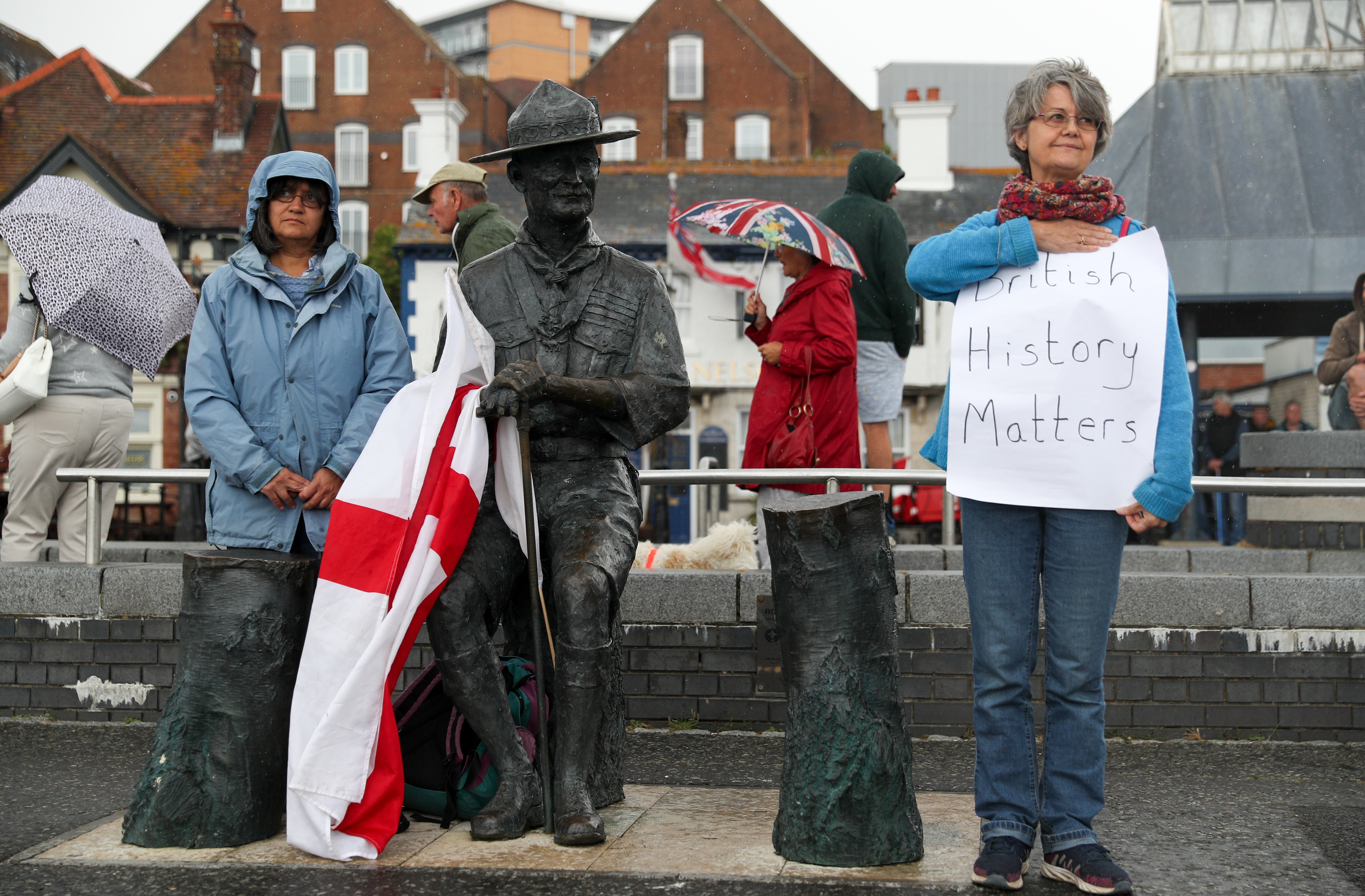 Locals show their support for a statue of Robert Baden-Powell on Poole Quay in Dorset ahead of its expected removal to "safe storage" following concerns about his actions while in the military and "Nazi sympathies". The action follows a raft of Black Lives Matter protests across the UK, sparked by the death of George Floyd, who was killed on May 25 while in police custody in the US city of Minneapolis.
