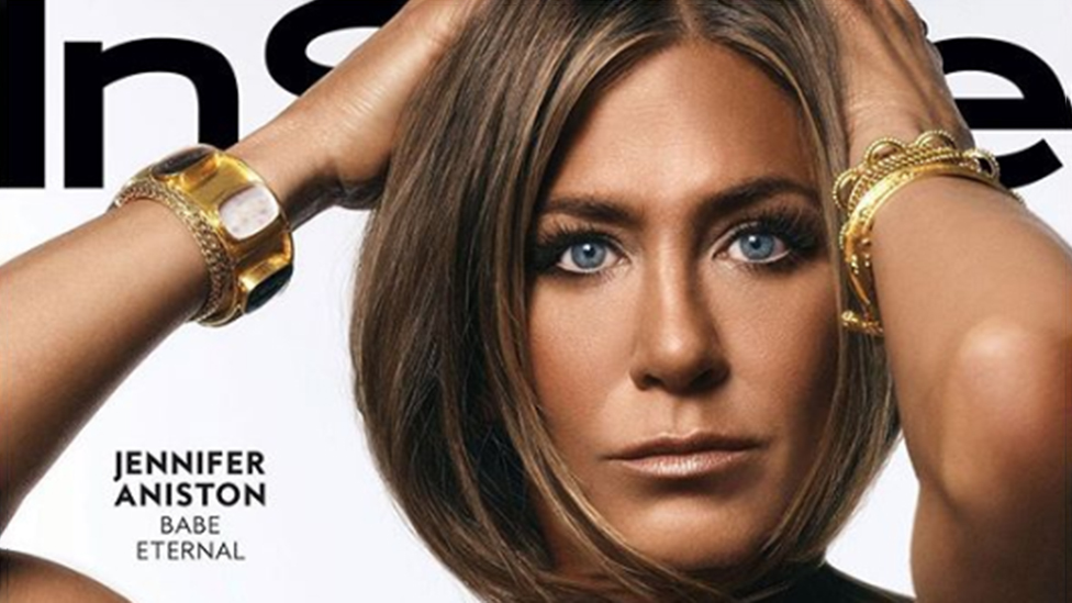 Jennifer Aniston and the charm bracelet she wears on the Elle cover