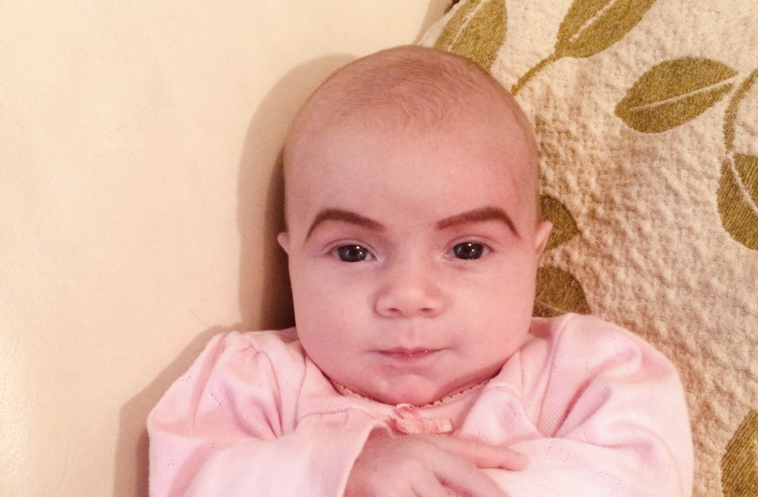 Mum hilariously draws eyebrows on her baby