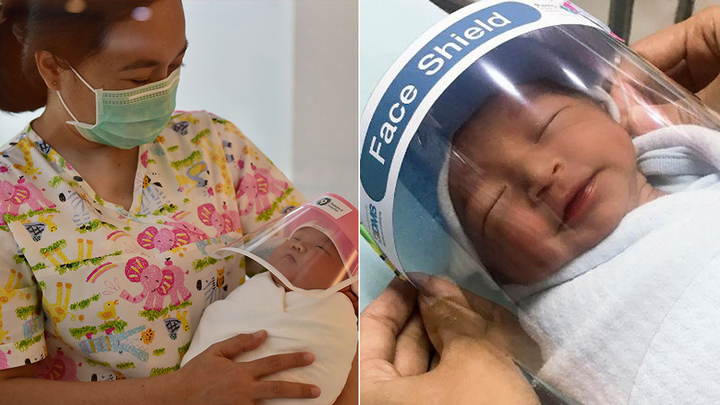 Newborn baby wears a face shield in Bangkok hospital