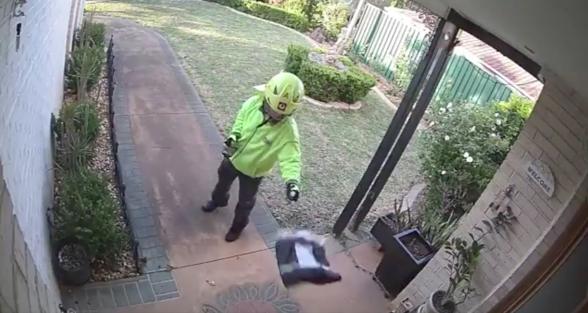 Australia Post deliverer caught on camera throwing parcel 'like a frisbee'