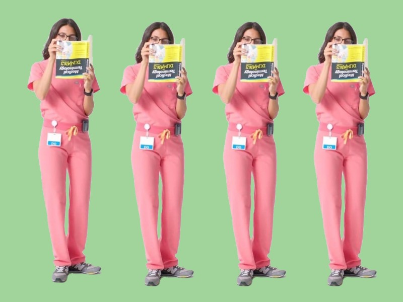 FIGS called out for featuring female doctor reading 'Dummies' book upside  down