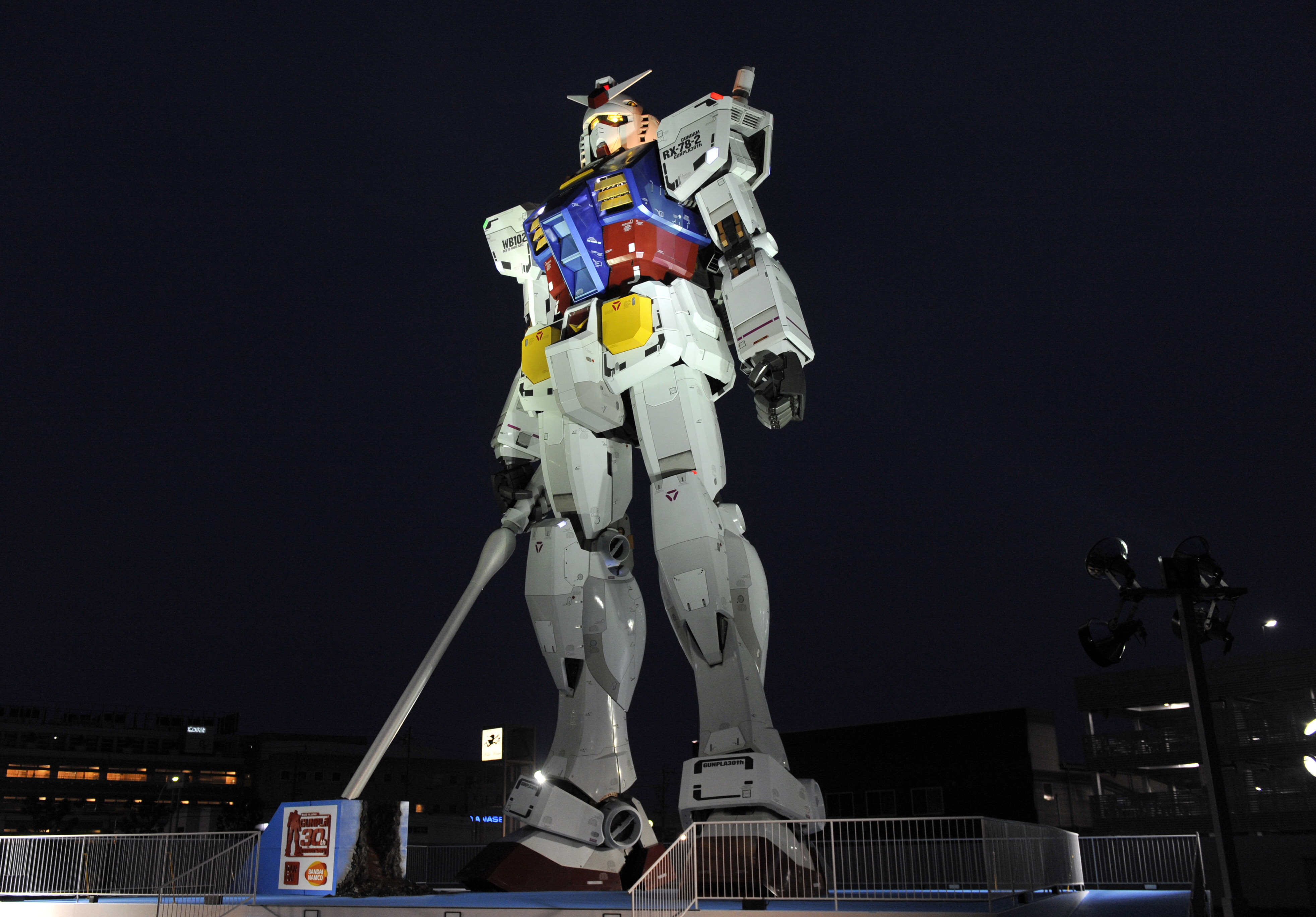An 18-metre tall statue of popular TV animation hero Gundam is lit up at a park in Shizuoka city, 150km west of Tokyo on July 6, 2010 for a press preview. The huge statue of the life sized robot, which attracted over 3 million spectators in Tokyo last year, will be displayed for the commemoration of the 30th anniversary of the establishment of the Gundam plastic models. The statue will be opened to the public from July 24 through the early next year. AFP PHOTO/YOSHIKAZU TSUNO (Photo credit should read YOSHIKAZU TSUNO/AFP via Getty Images)