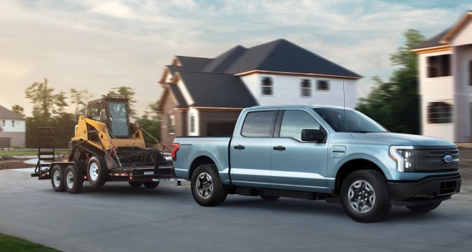 2022 Ford F-150 Lightning Pro. Pre-production model with available features shown. Available starting spring 2022. Max towing varies based on cargo, vehicle configuration, accessories and number of passengers.