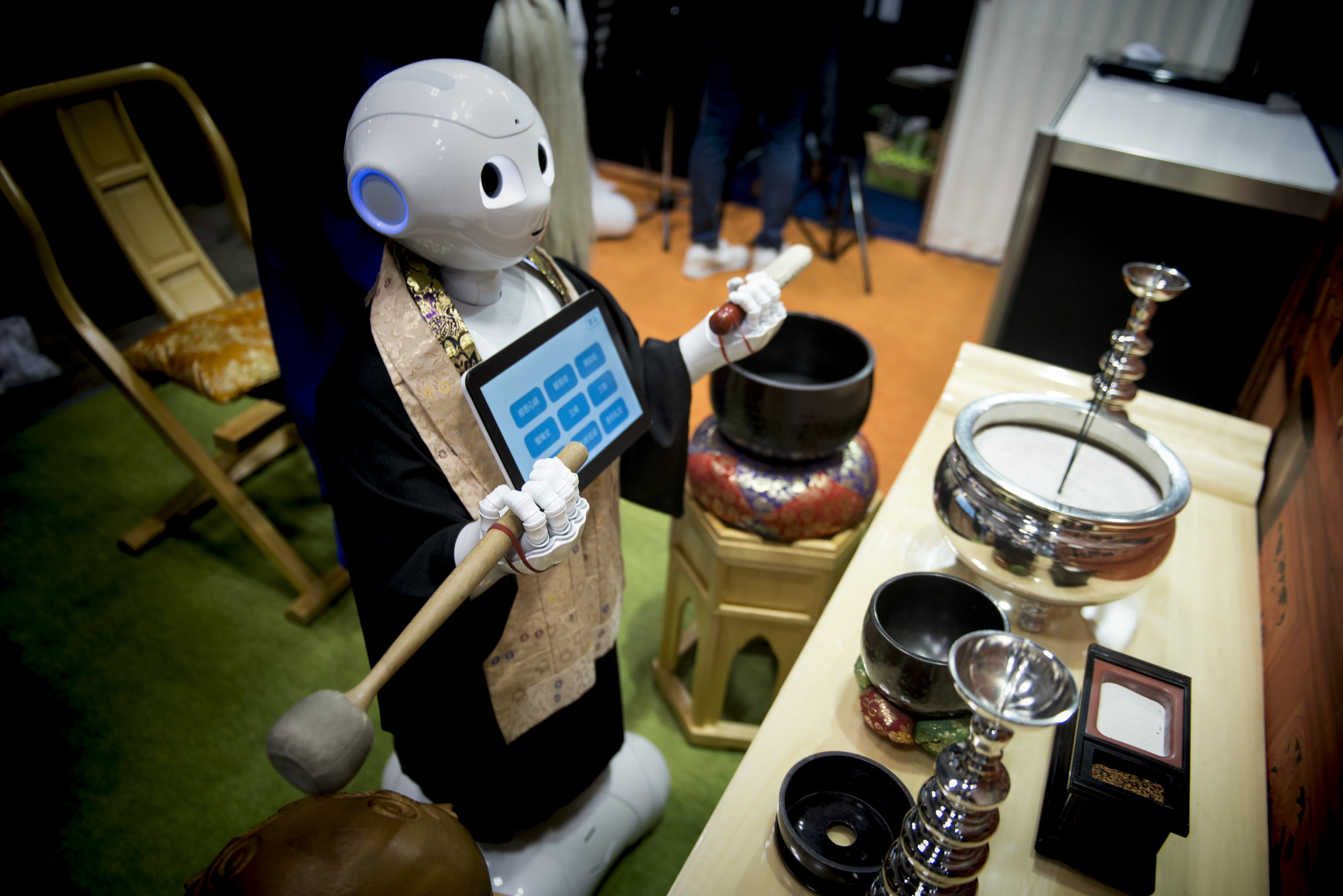 Pepper human-shaped robot while celebrating the Buddhist funeral rites to the Tokyo Int'l Funeral & Cemetery Show in Tokyo August 23, 2017. Hundreds of funeral home operators, cemeteries operators, crematorium operators, traders, suppliers, buyers, professional associations and investors gather at this professional funeral event in Japan. (Photo by Alessandro Di Ciommo/NurPhoto via Getty Images)