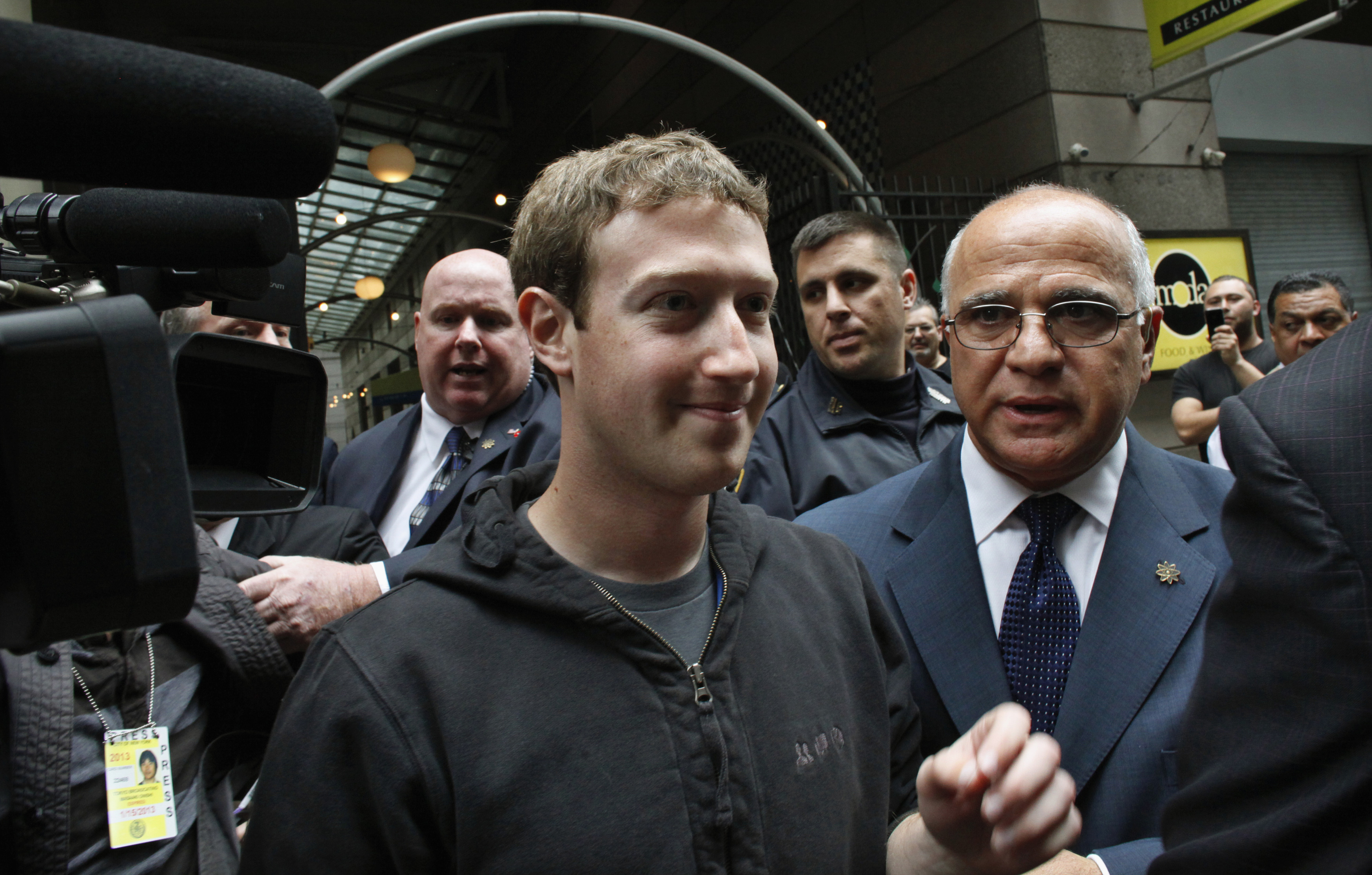 Facebook Inc. CEO Mark Zuckerberg is escorted by security guards as he departs New York City's Sheraton Hotel May 7, 2012. Facebook Inc kicked off its IPO roadshow in New York on Monday, attracting hundreds of investors to the Sheraton as the world's largest social network aims to raise about $10.6 billion, dwarfing the coming-out parties of tech companies like Google Inc and granting it a market value close to Amazon.com Inc's. REUTERS/Eduardo Munoz (UNITED STATES - Tags: BUSINESS SCIENCE TECHNOLOGY)