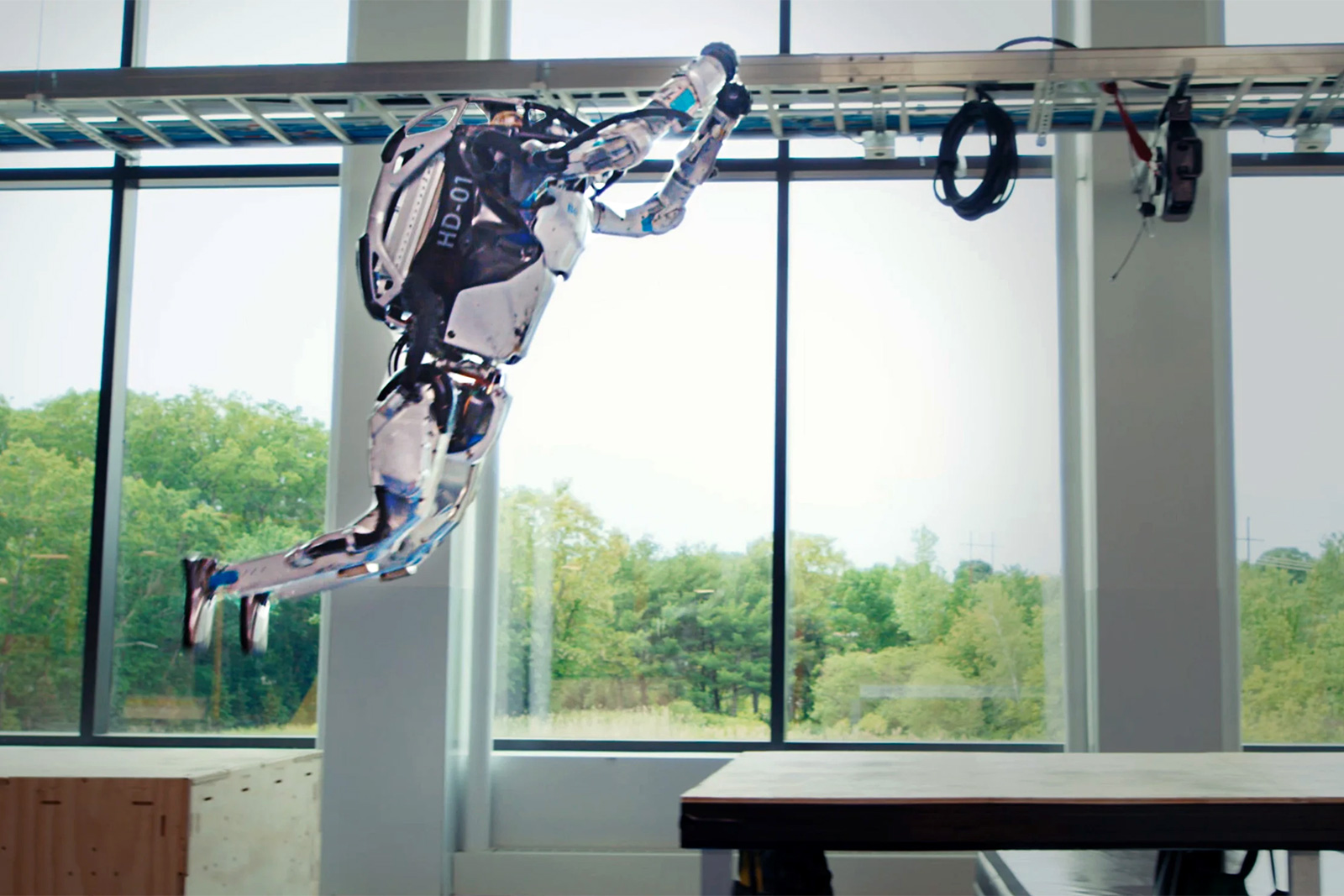 Boston Dynamics Atlas robot performing a parkour leap
