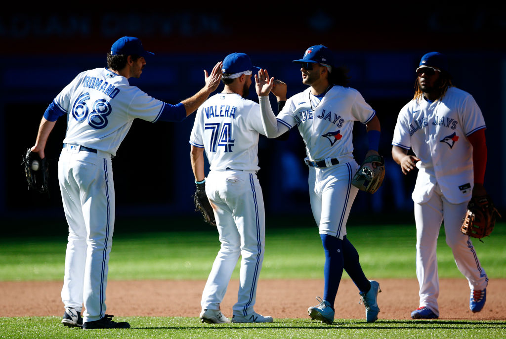 Blue Jays whoop it up after clinching spot in playoffs before wild-card  matchup against Twins - The Globe and Mail