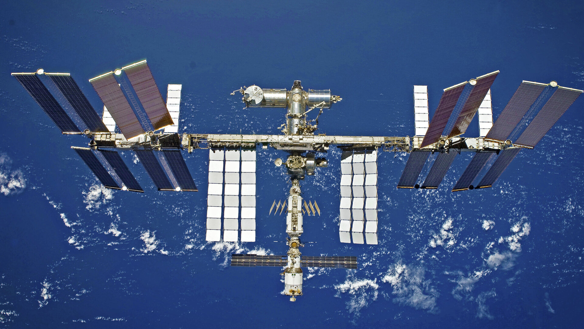 Satellite space debris forces ISS astronauts to seek shelter aboard docked capsules