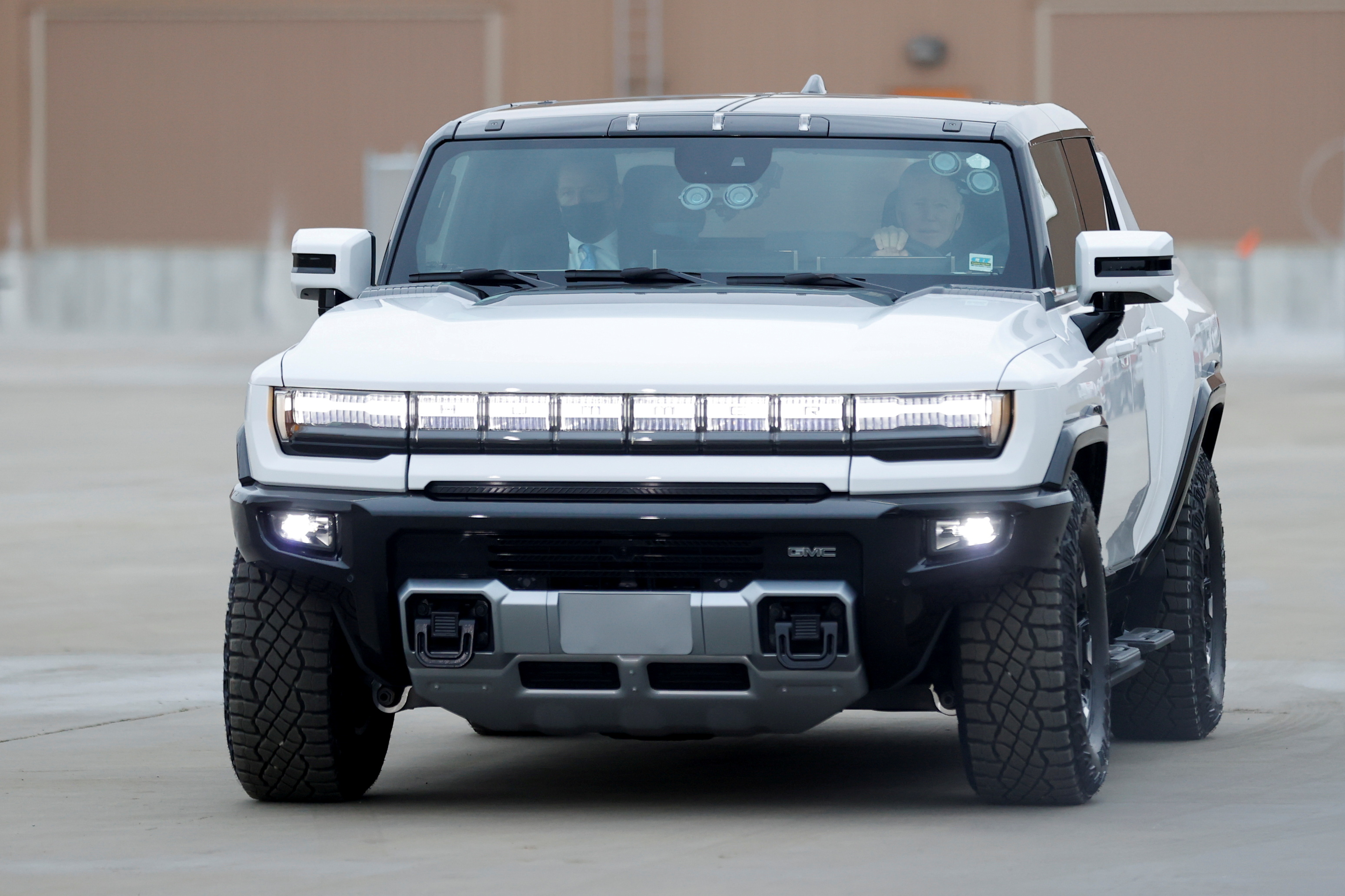 U.S. President Joe Biden drives a Hummer EV as he tours the General Motors 'Factory ZERO' electric vehicle assembly plant in Detroit, Michigan, U.S. November 17, 2021. REUTERS/Jonathan Ernst