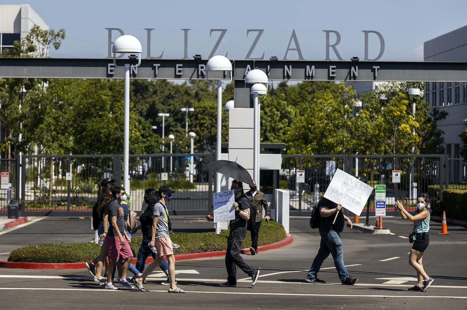 Irvine, CA - July 28: Several hundred Activision Blizzard employees stage a walkout which they say is in a response from company leadership to a lawsuit highlighting alleged harassment, inequality, and more within the company outside the gate at Activision Blizzard headquarters on Wednesday, July 28, 2021 in Irvine, CA. (Allen J. Schaben / Los Angeles Times via Getty Images)