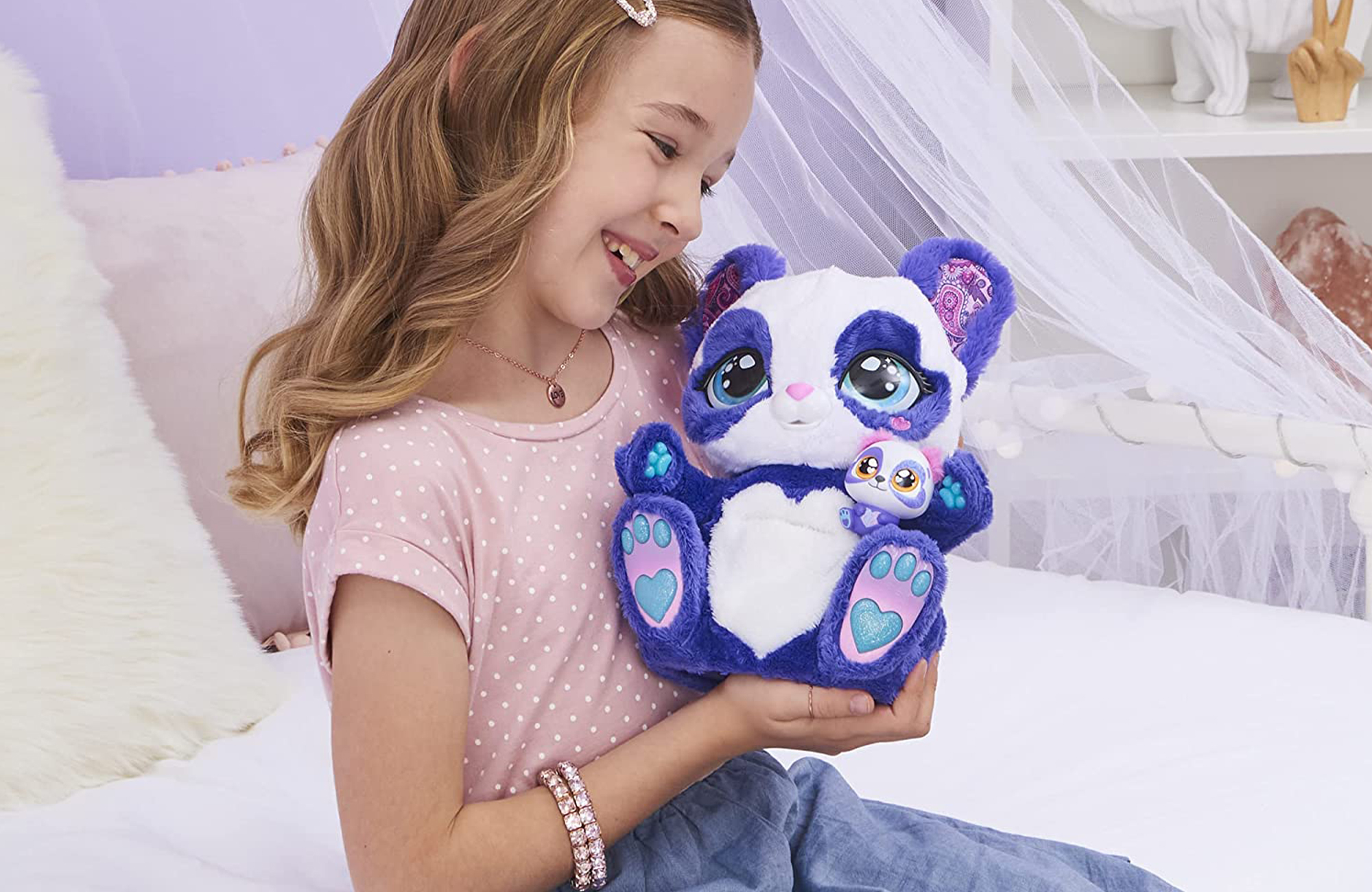 A child with the Peek-a-Roo doll for the Engadget 2021 Holiday Gift Guide. 