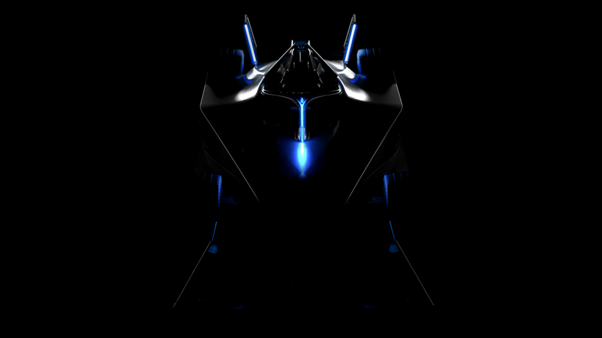 A teaser image of the Formula E Gen3 race car, showing the vehicle from above, lit only by a few onboard indicators.