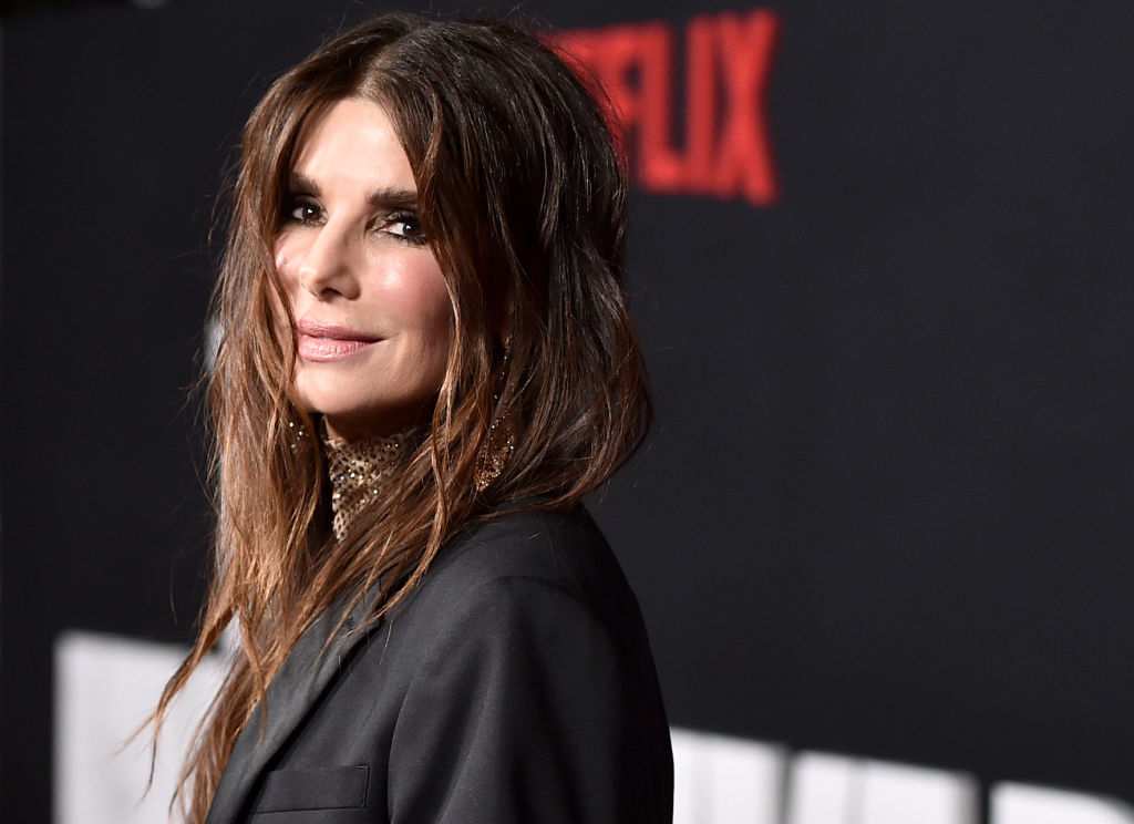 Sandra Bullock knockout in skintight catsuit - but how many people in her  red carpet glam squad?