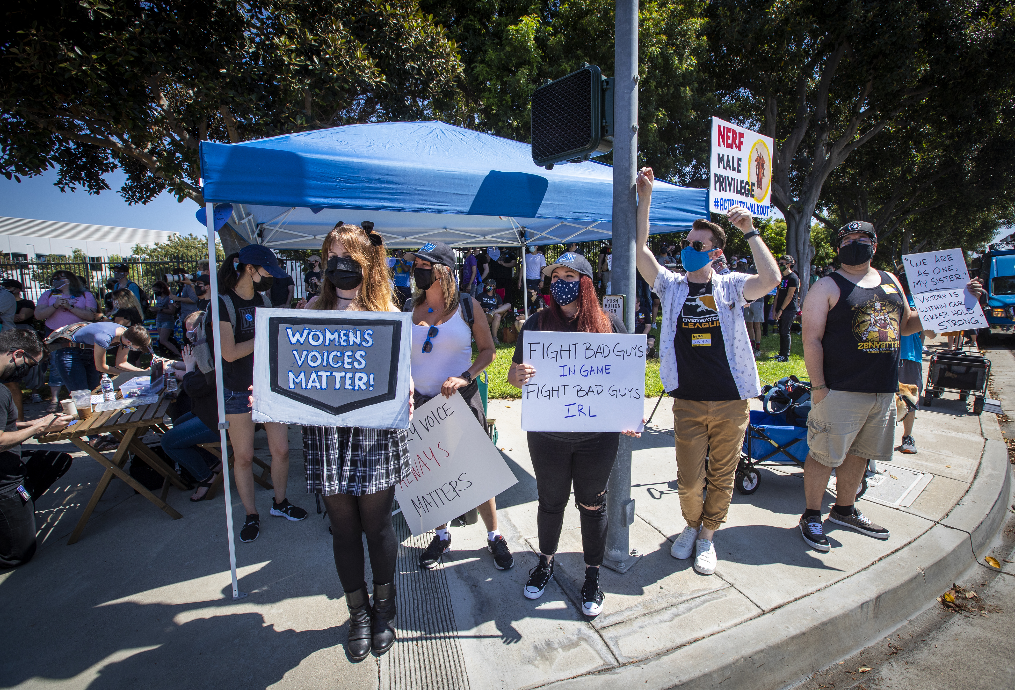 Irvine, CA - July 28: Several hundred Activision Blizzard employees stage a walkout which they say is in a response from company leadership to a lawsuit highlighting alleged harassment, inequality, and more within the company outside the gate at Activision Blizzard headquarters on Wednesday, July 28, 2021 in Irvine, CA. (Allen J. Schaben / Los Angeles Times via Getty Images)