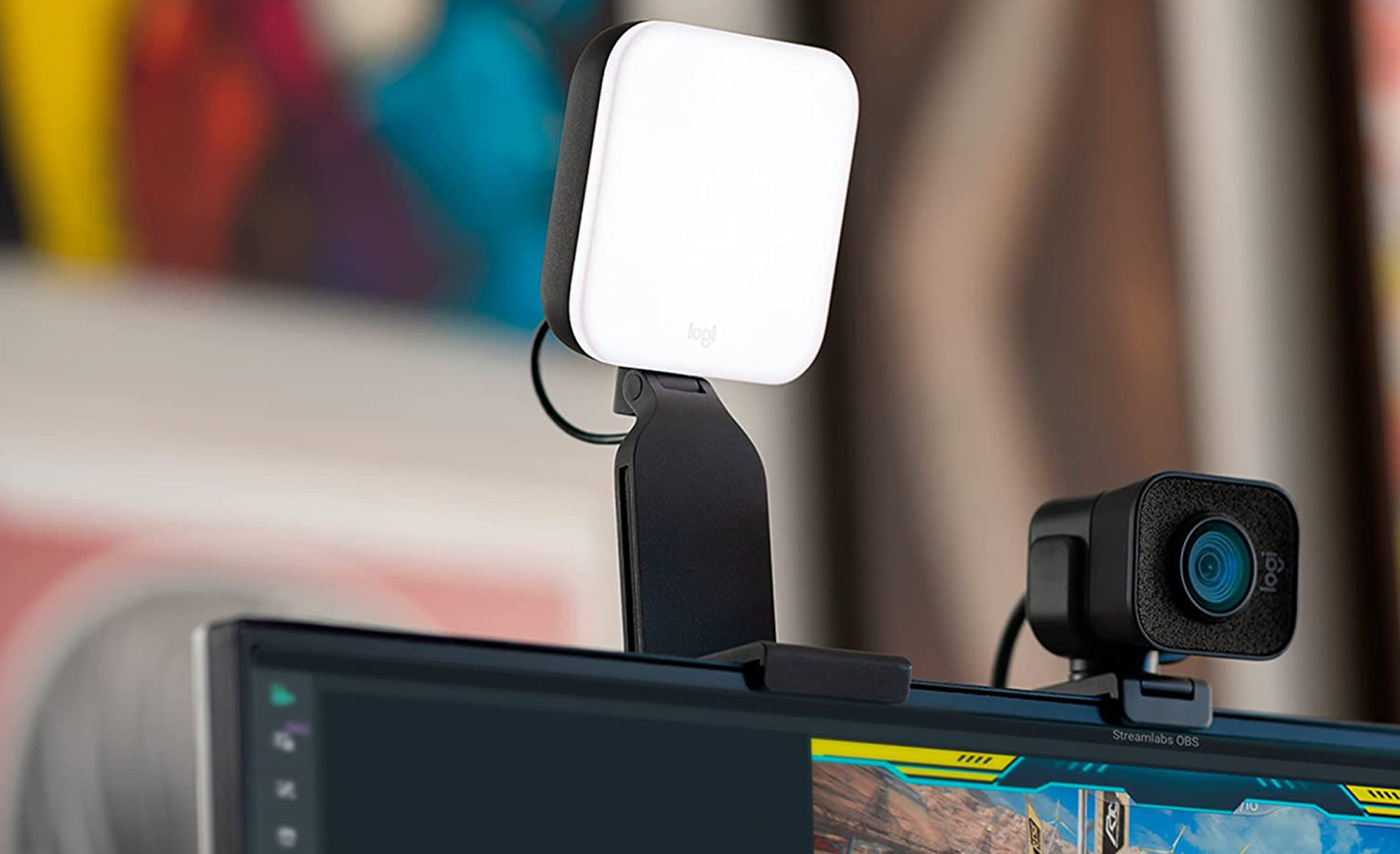 The Logitech Litra Glow light attached to the top of a monitor, next to a webcam.