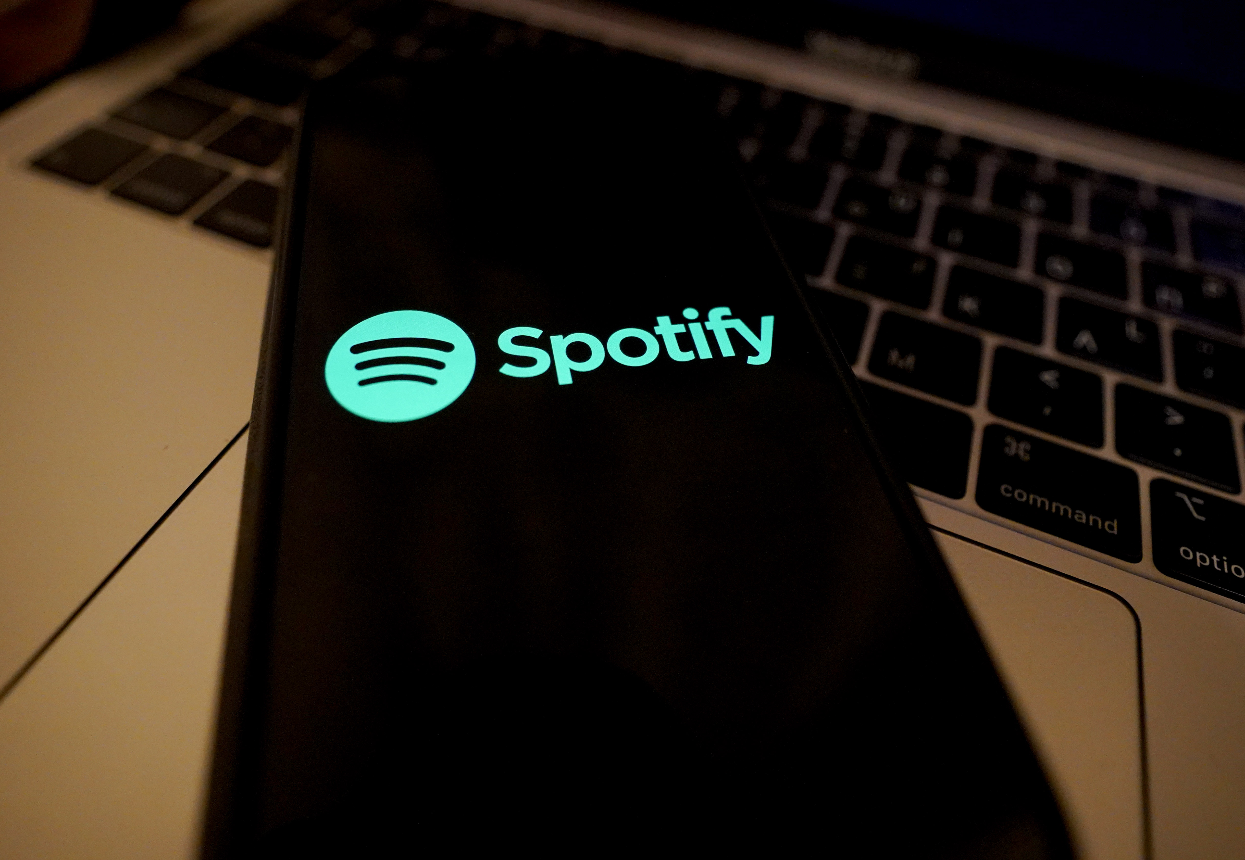 In this photo illustration a Spotify logo seen displayed on a smartphone in Athens, on 21 April 2022. (Photo illustration by Giannis Alexopoulos/NurPhoto via Getty Images)