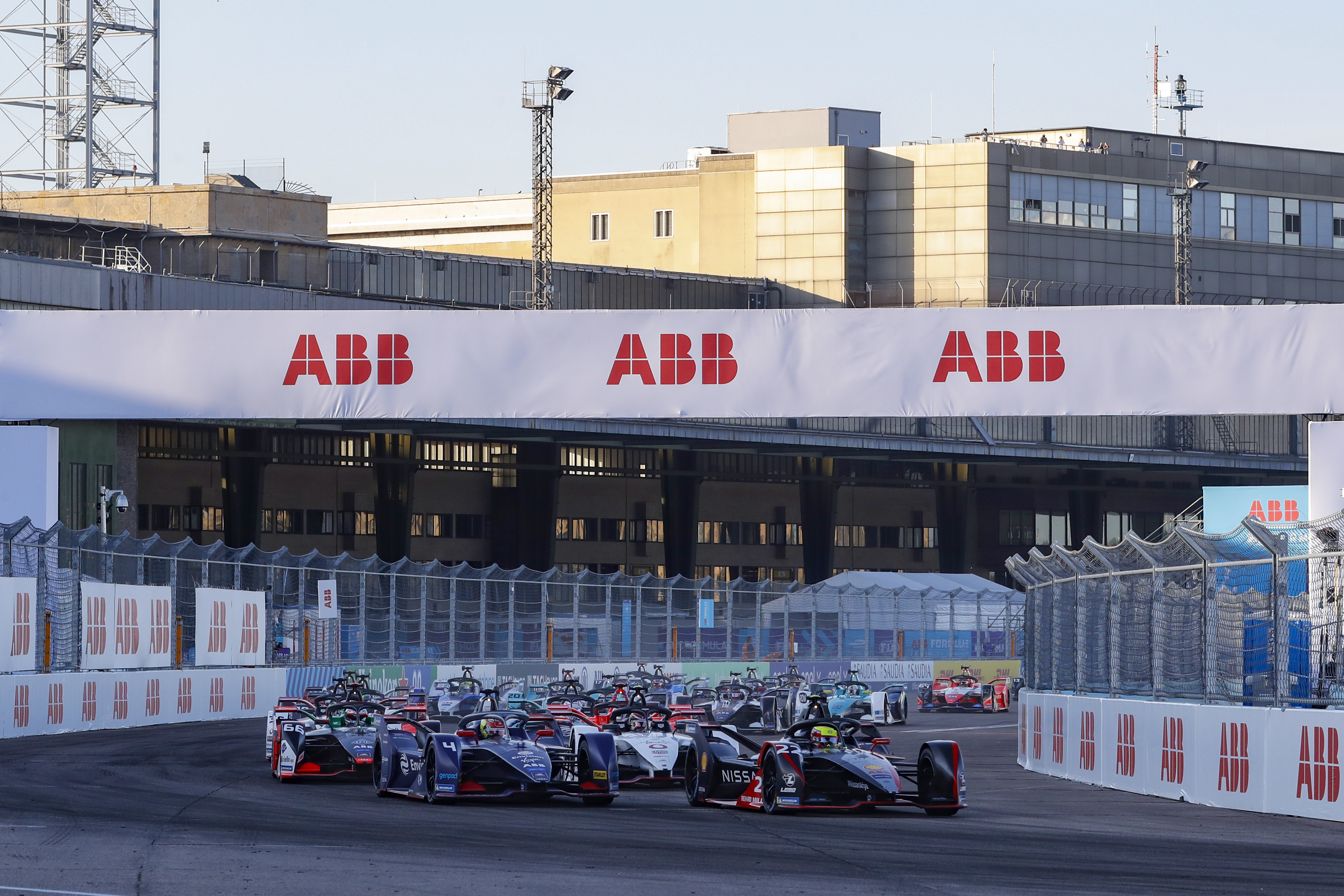 BERLIN, GERMANY - AUGUST 12: In this handout provided by FIA Formula E,  Oliver Rowland (GBR), Nissan e.Dams, Nissan IMO2 and Robin Frijns (NLD), Envision Virgin Racing, Audi e-tron FE06 lead the field away at the start on August 12, 2020 in Berlin, Germany. (Photo by Alastair Staley/FIA ABB Formula E/Getty Images)