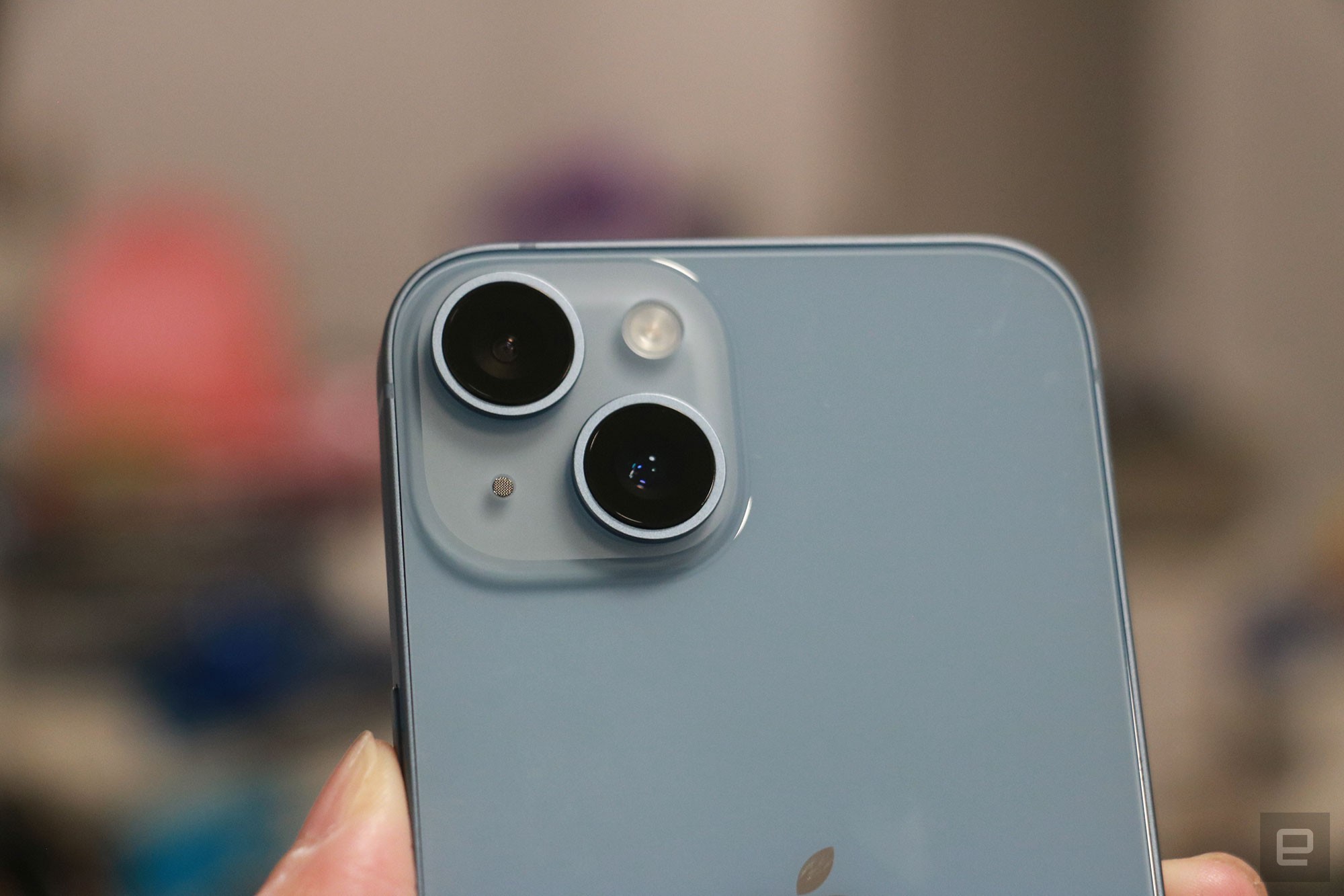 Close up on the blue iPhone 14's dual rear cameras.