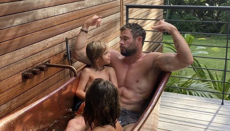 Elsa Pataky flexes her strong arms and very toned back in