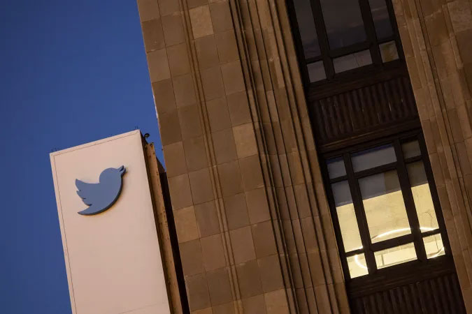 Image of the Twitter logo on the side of its HQ