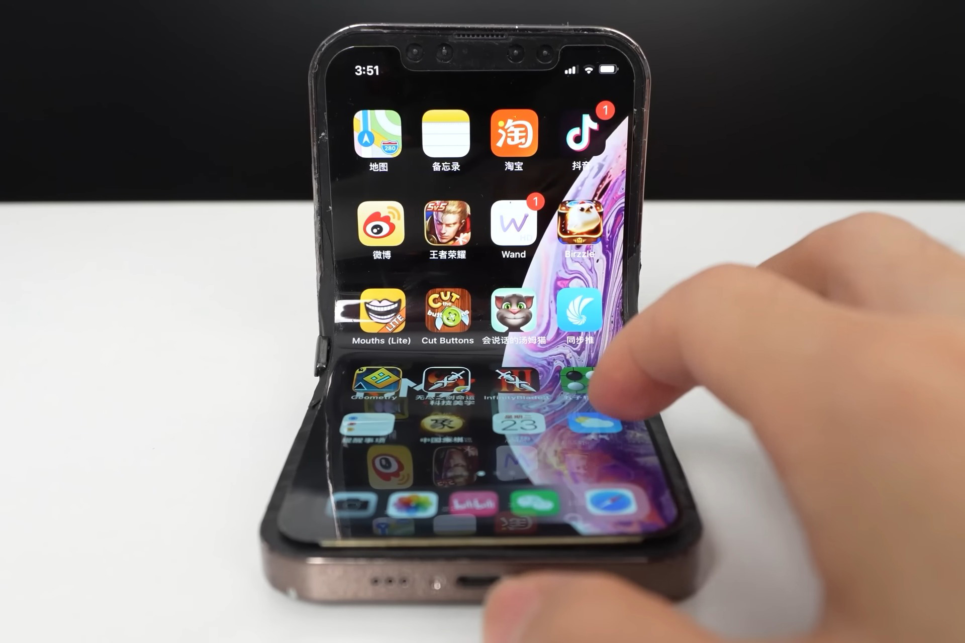 Modders thought it would be fun to make a folding iPhone