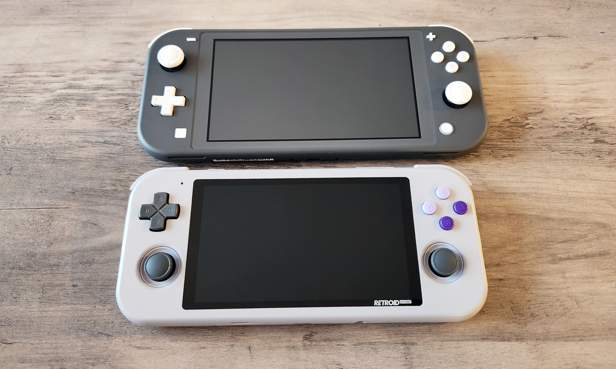 Retroid's Pocket 3 (bottom) compared to the Nintendo Switch Lite.