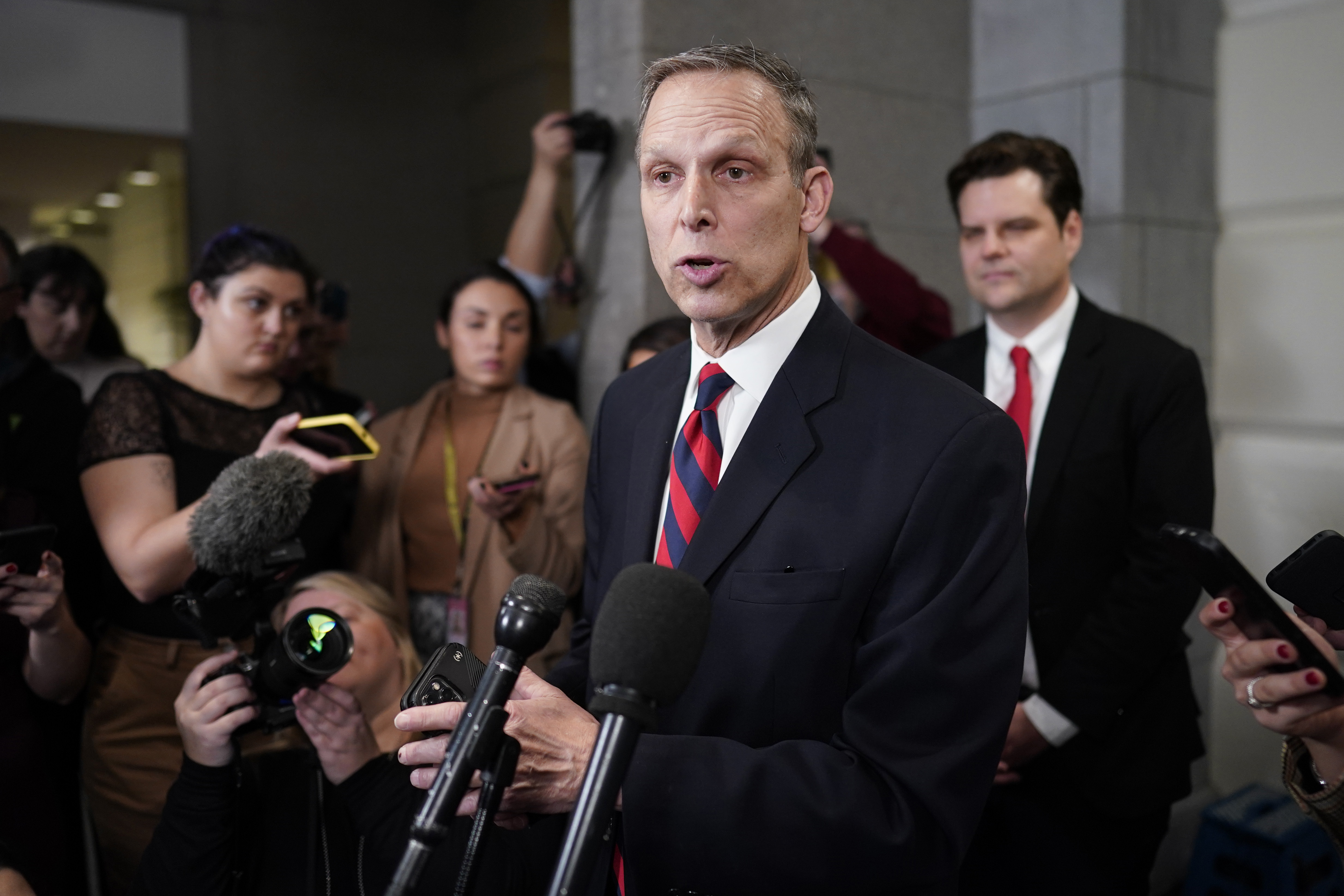 Rep. Scott Perry, R-Pa., speaks at the Capitol in Washington, Tuesday, Jan. 3, 2023, on the opening day of the 118th Congress. Rep. Matt Gaetz, R-Fla., listens at right. (AP Photo/J. Scott Applewhite)