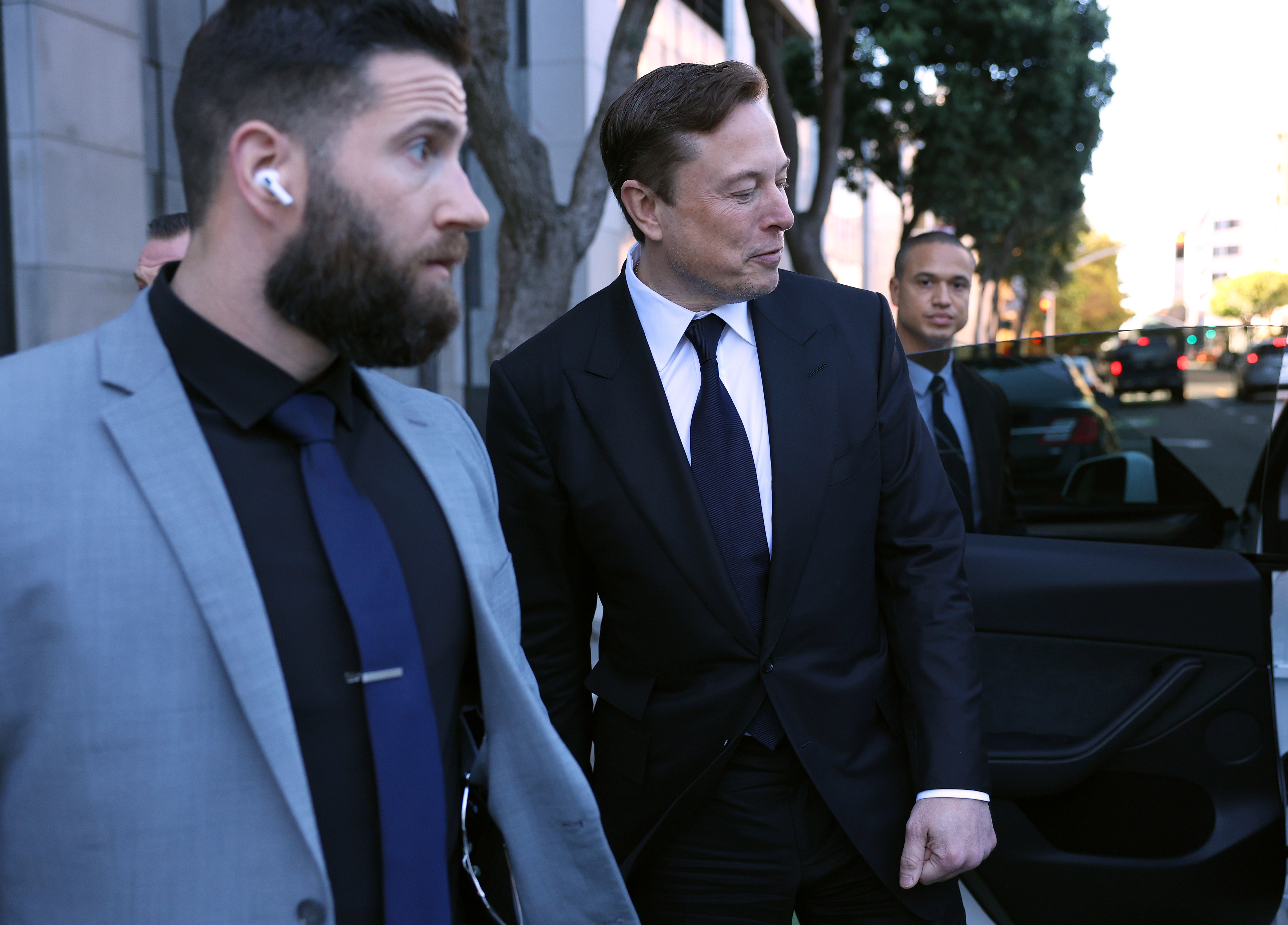 SAN FRANCISCO, CALIFORNIA - JANUARY 24: Tesla CEO Elon Musk leaves the Phillip Burton Federal Building on January 24, 2023 in San Francisco, California. Musk testified at a trial regarding a lawsuit that has investors suing Tesla and Musk over his August 2018 tweets saying he was taking Tesla private with funding that he had secured. The tweet was found to be false and cost shareholders billions of dollars when Tesla's stock price began to fluctuate wildly allegedly based on the tweet. (Photo by Justin Sullivan/Getty Images)