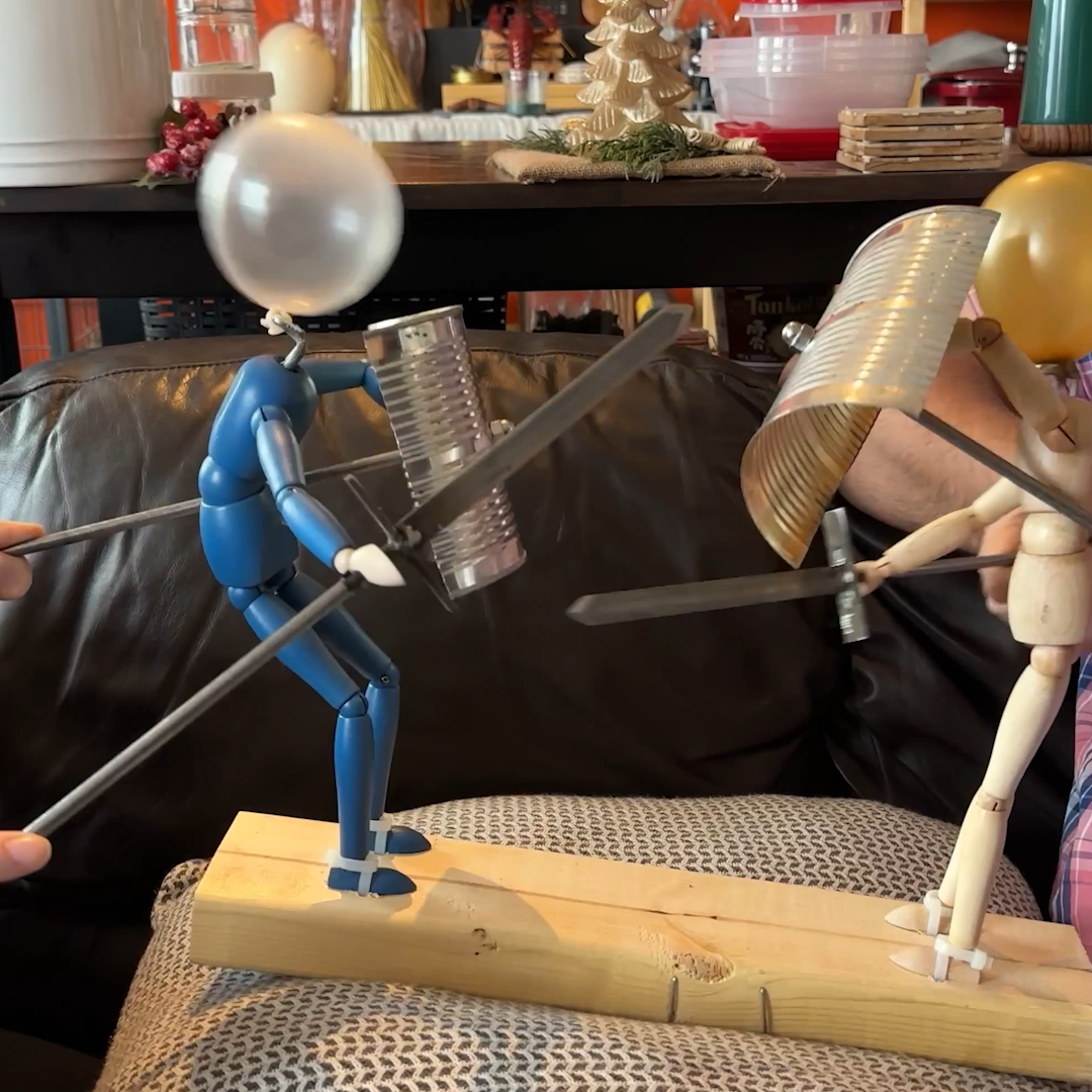 Man Creates Rock 'Em Sock 'Em Robots with Balloons for Heads 