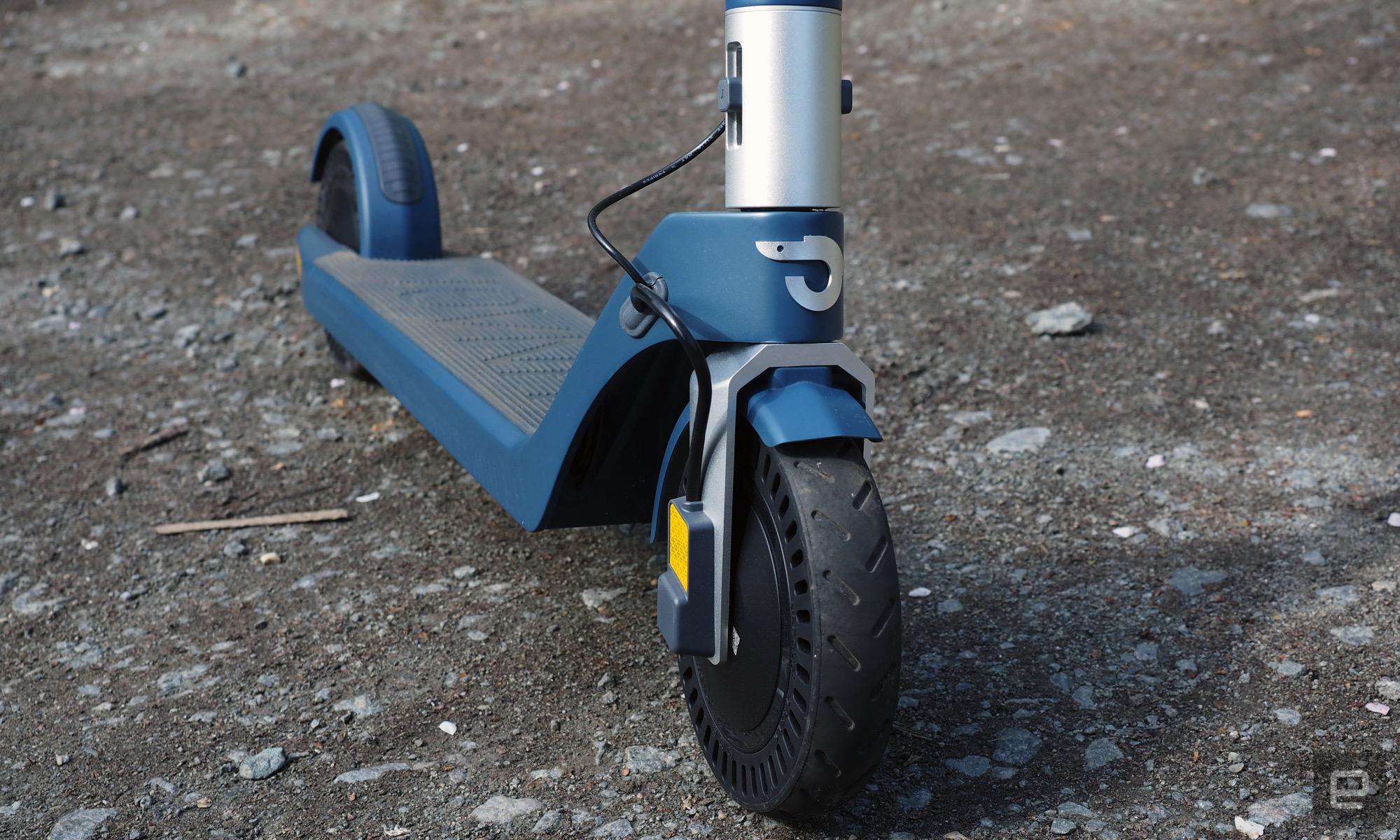 Close-up of the front wheel and deck of the Unagi Model One Voyager