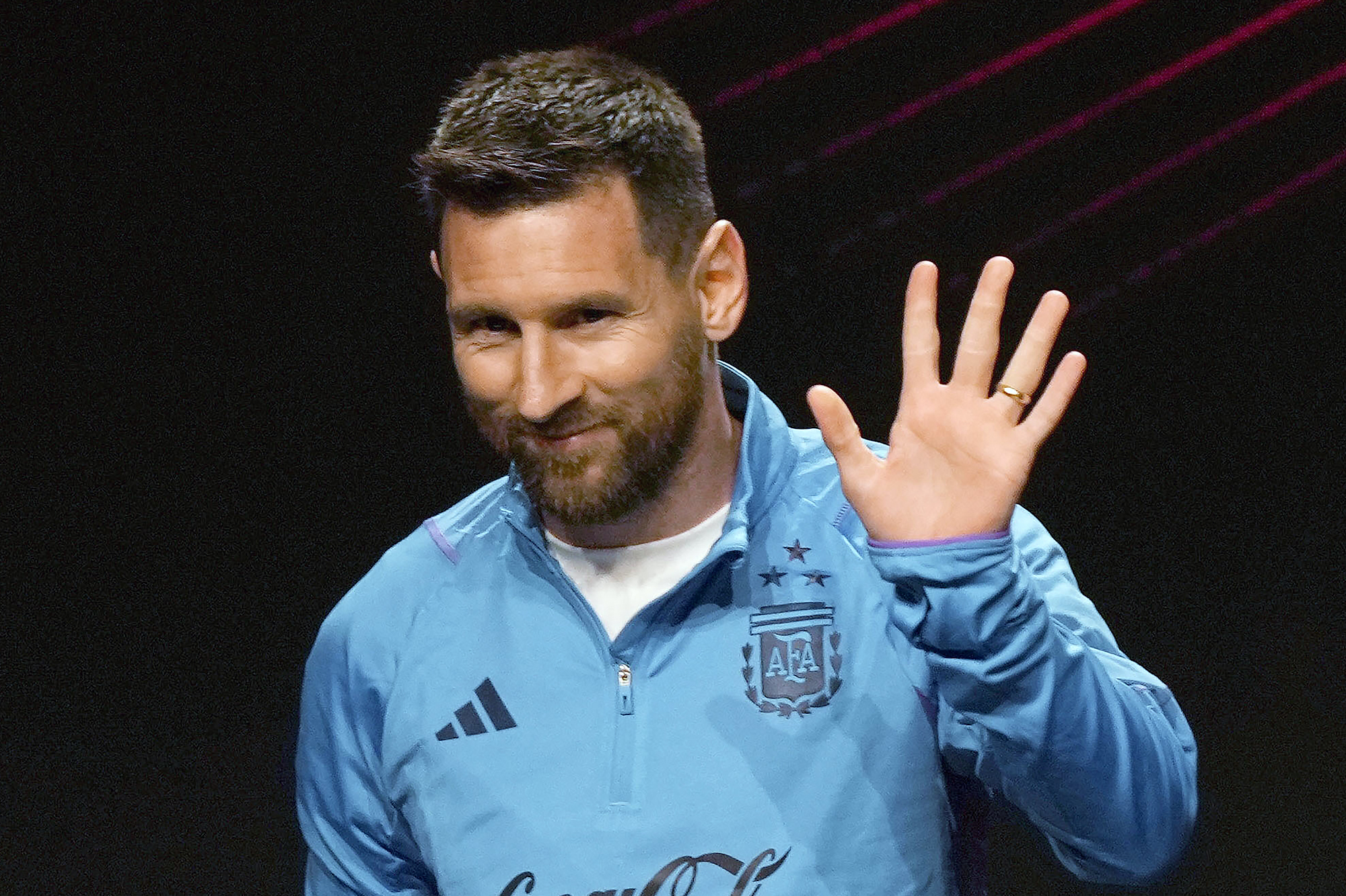 FILE - Argentina soccer star Lionel Messi waves during a ceremony at the CONMEBOL headquarters in Asuncion, Paraguay, Monday, March 27, 2023. Lionel Messi says he is coming to Inter Miami and joining Major League Soccer. After months of speculation, Messi announced his decision Wednesday, June 7, to join a Miami franchise that has been led by another global soccer icon in David Beckham since its inception but has yet to make any real splashes on the field. (AP Photo/Jorge Saenz, File)