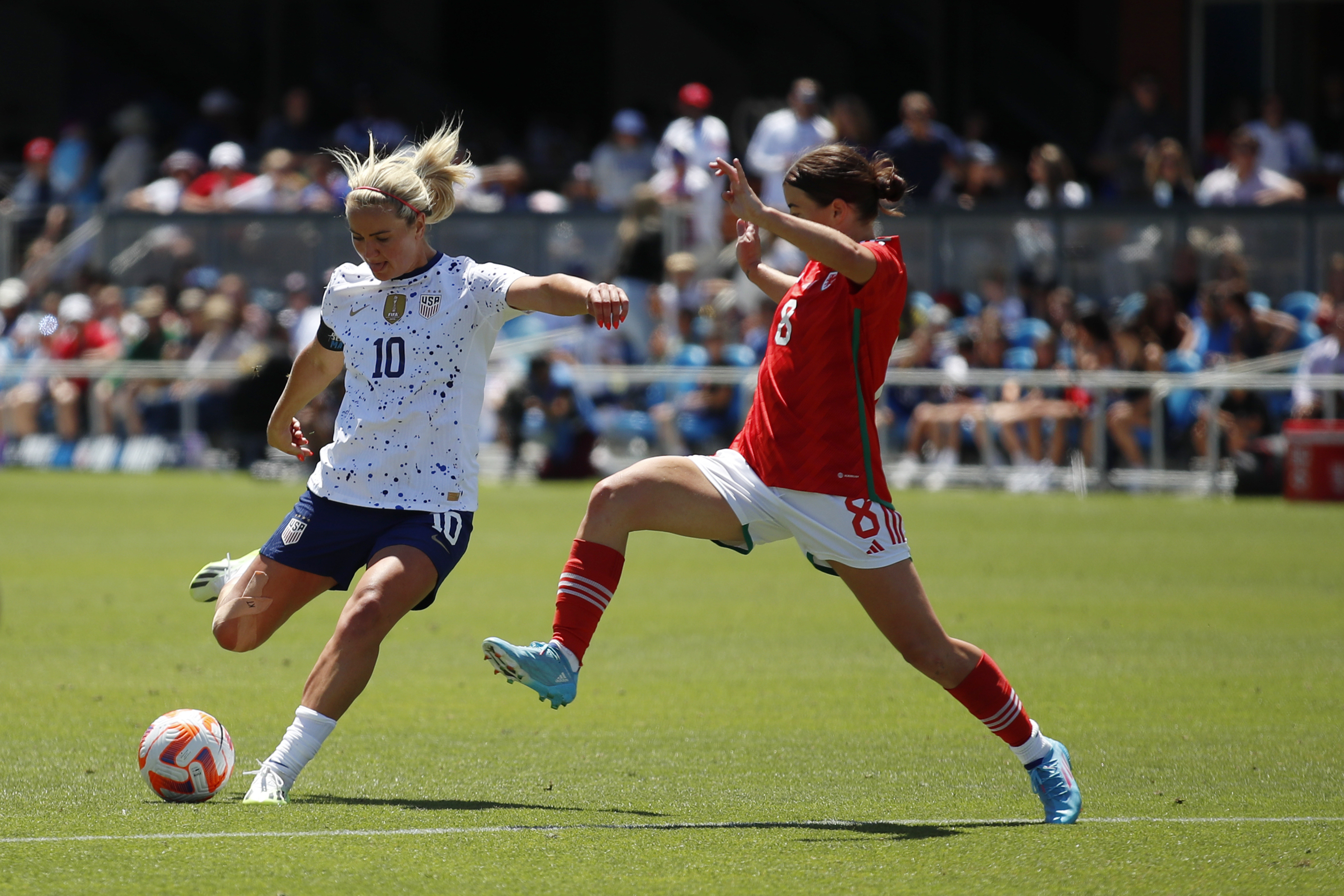 United States' Lindsey Horan (10) takes a shot against Wales' Angharad James (8) in the second half of a FIFA Women's World Cup send-off soccer match in San Jose, Calif., Sunday, July 9, 2023. (AP Photo/Josie Lepe)