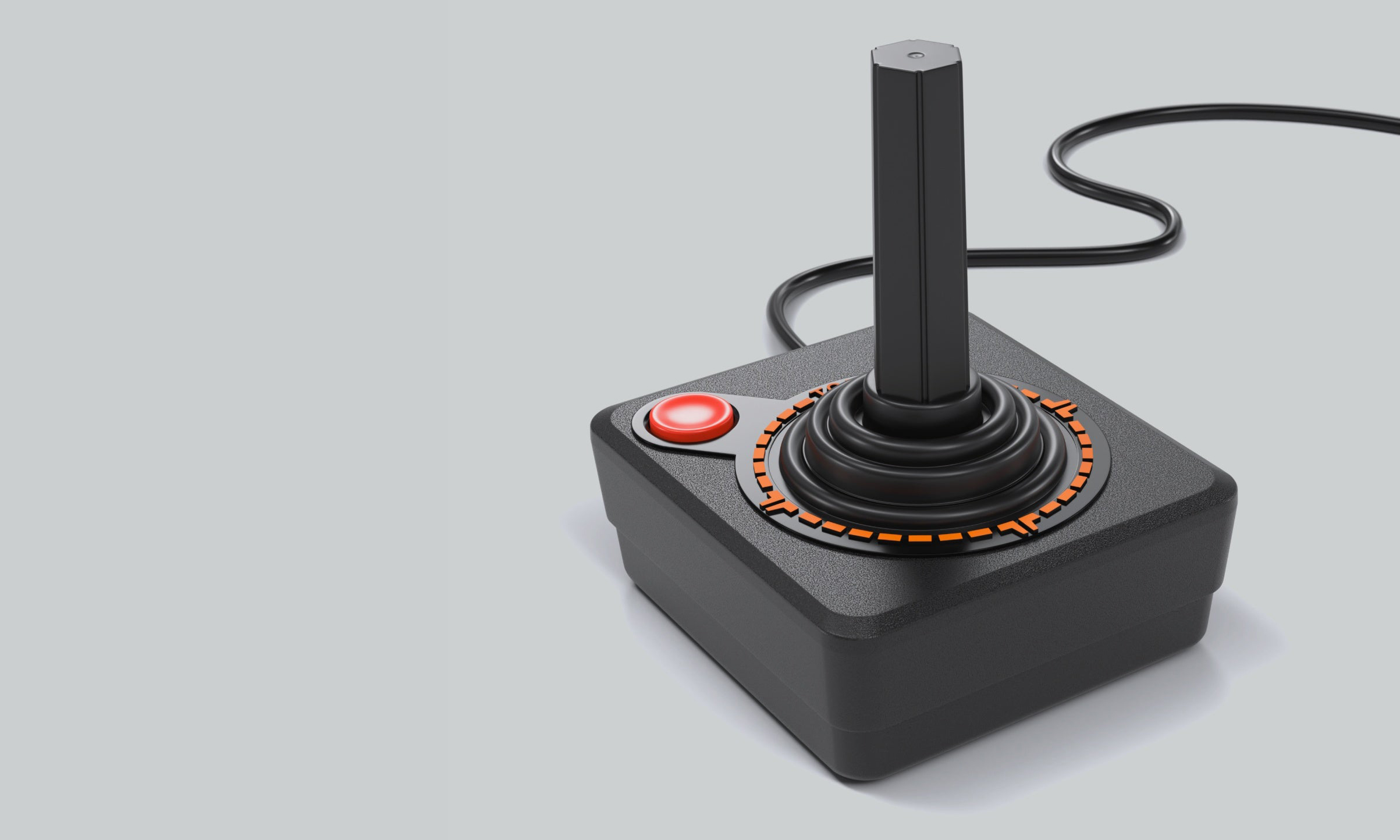 Marketingfoto für die Retro-Konsole Atari CX40+.  Das Zubehör sieht genauso aus wie der Vintage-Joystick: größtenteils schwarz mit einem einzelnen roten Knopf und einem hervorstehenden langen Stick.