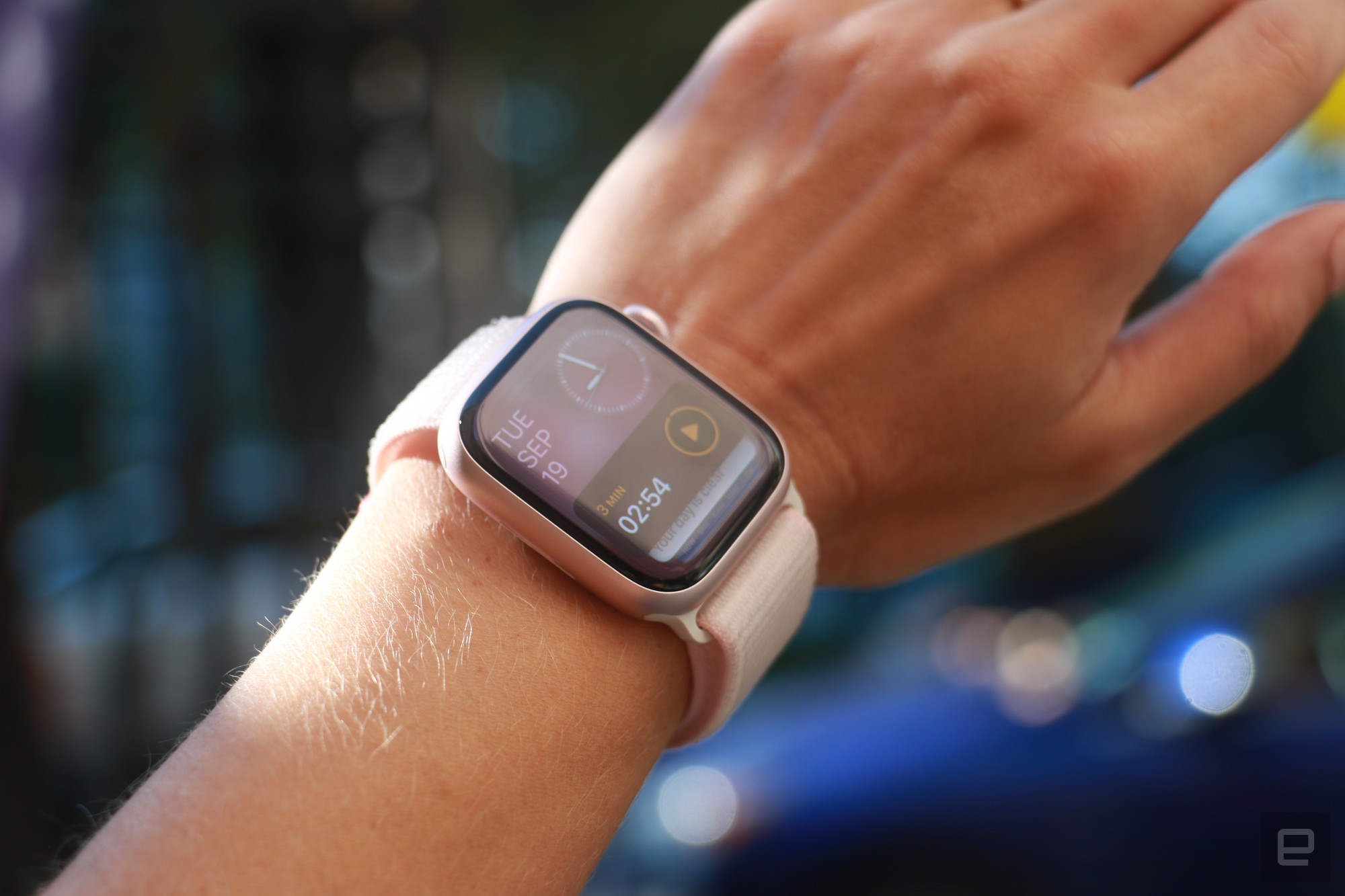 The Apple Watch Series 9 in mid-air on a wrist with the Smart Stack on the screen.