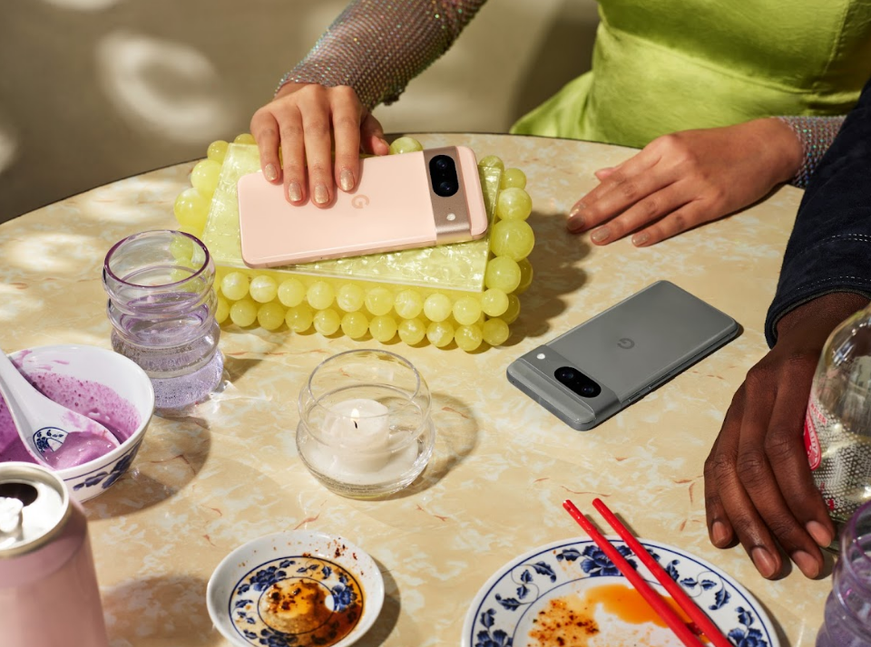 Two Pixel 8 devices on a table, surrounded by empty plates.