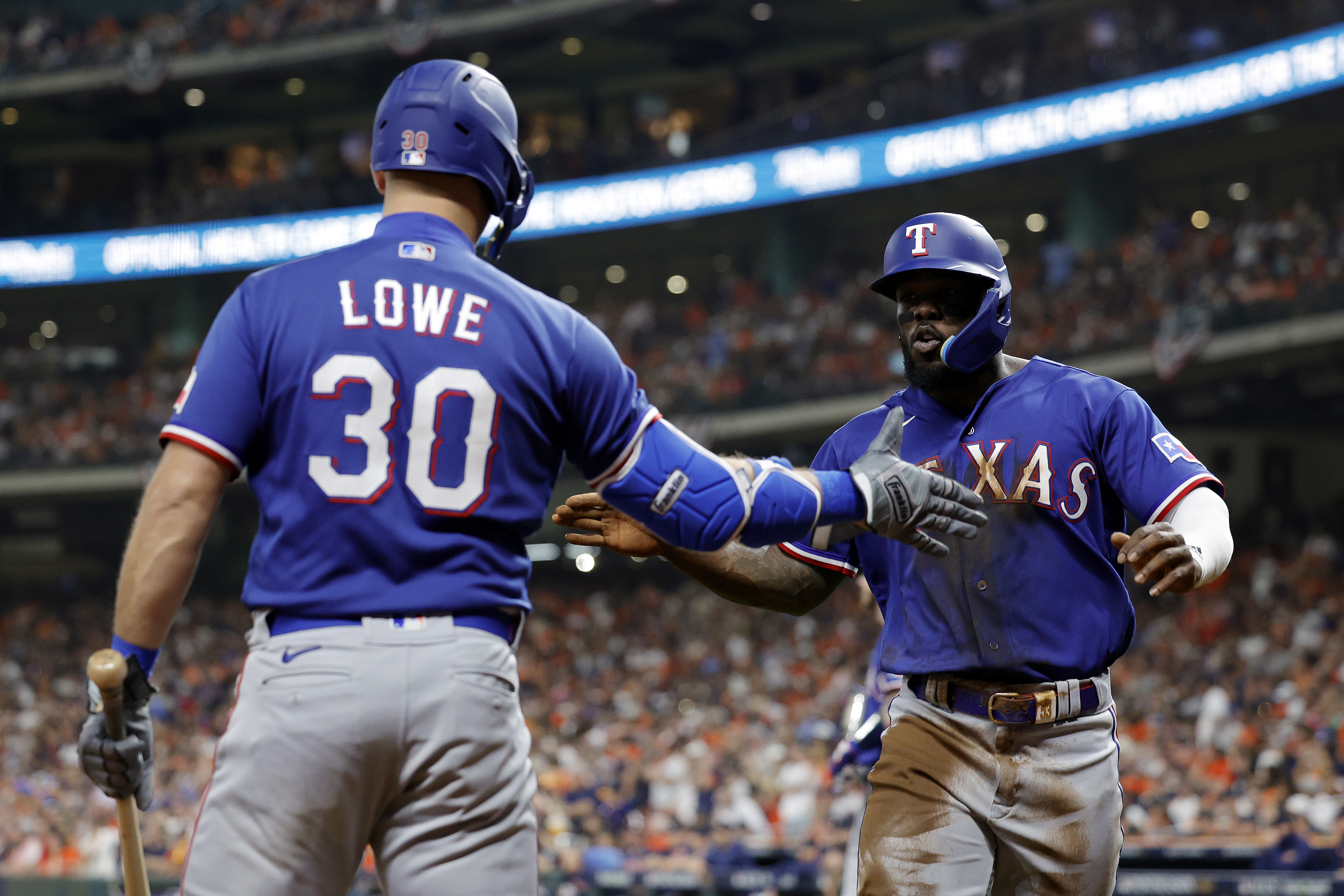 Adolis García and Nathaniel Lowe are good with their bats and their gloves. (Carmen Mandato/Getty Images)