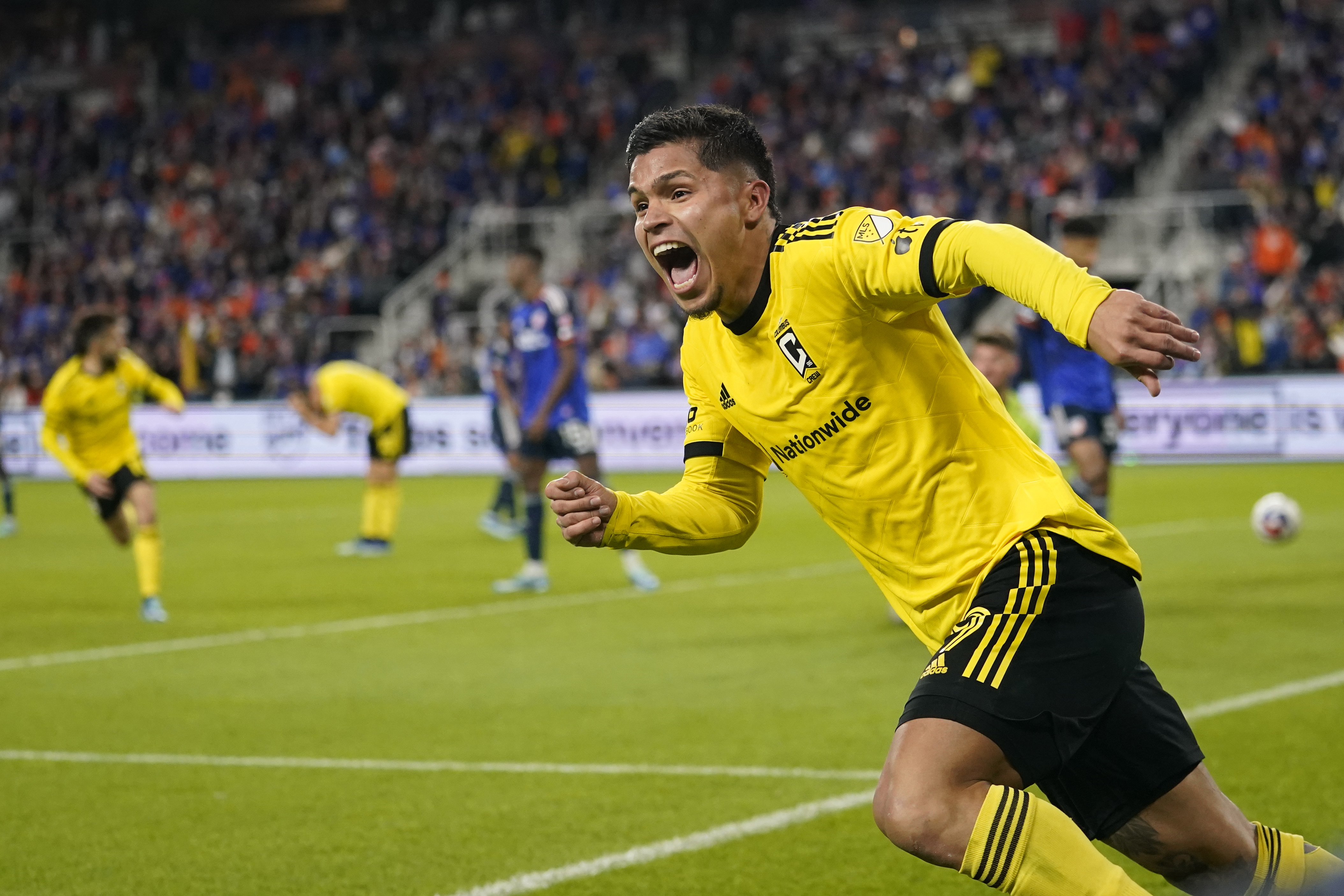 Columbus Crew forward Cucho Hernández (9) celebrates after teammate Christian Ramirez (17) scored during an MLS Eastern Conference final soccer match against FC Cincinnati, Saturday, Dec. 2, 2023, in Cincinnati. Columbus won 3-2 in overtime. (AP Photo/Carolyn Kaster)